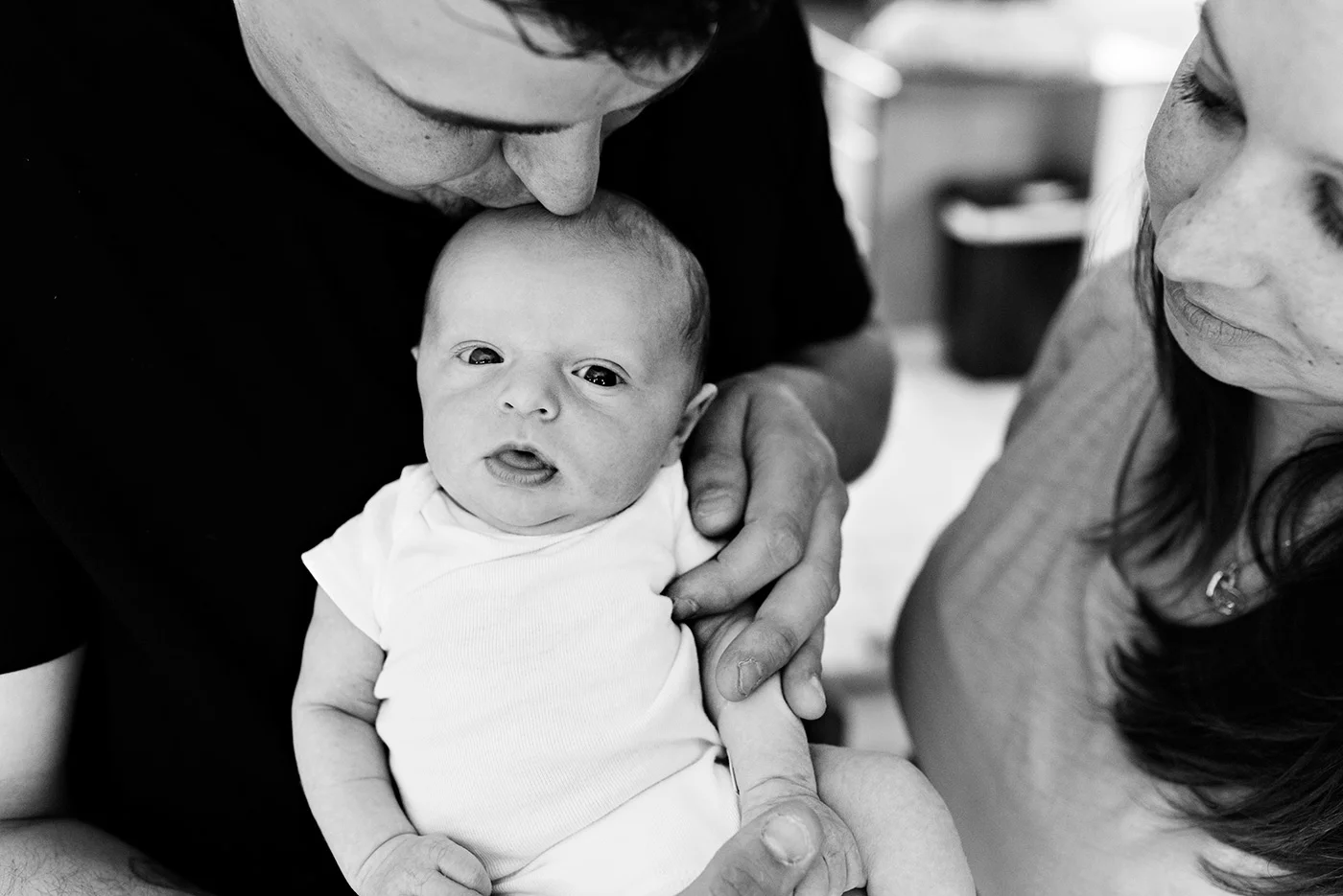 dad kissing newborn on head southington ct newborn photography