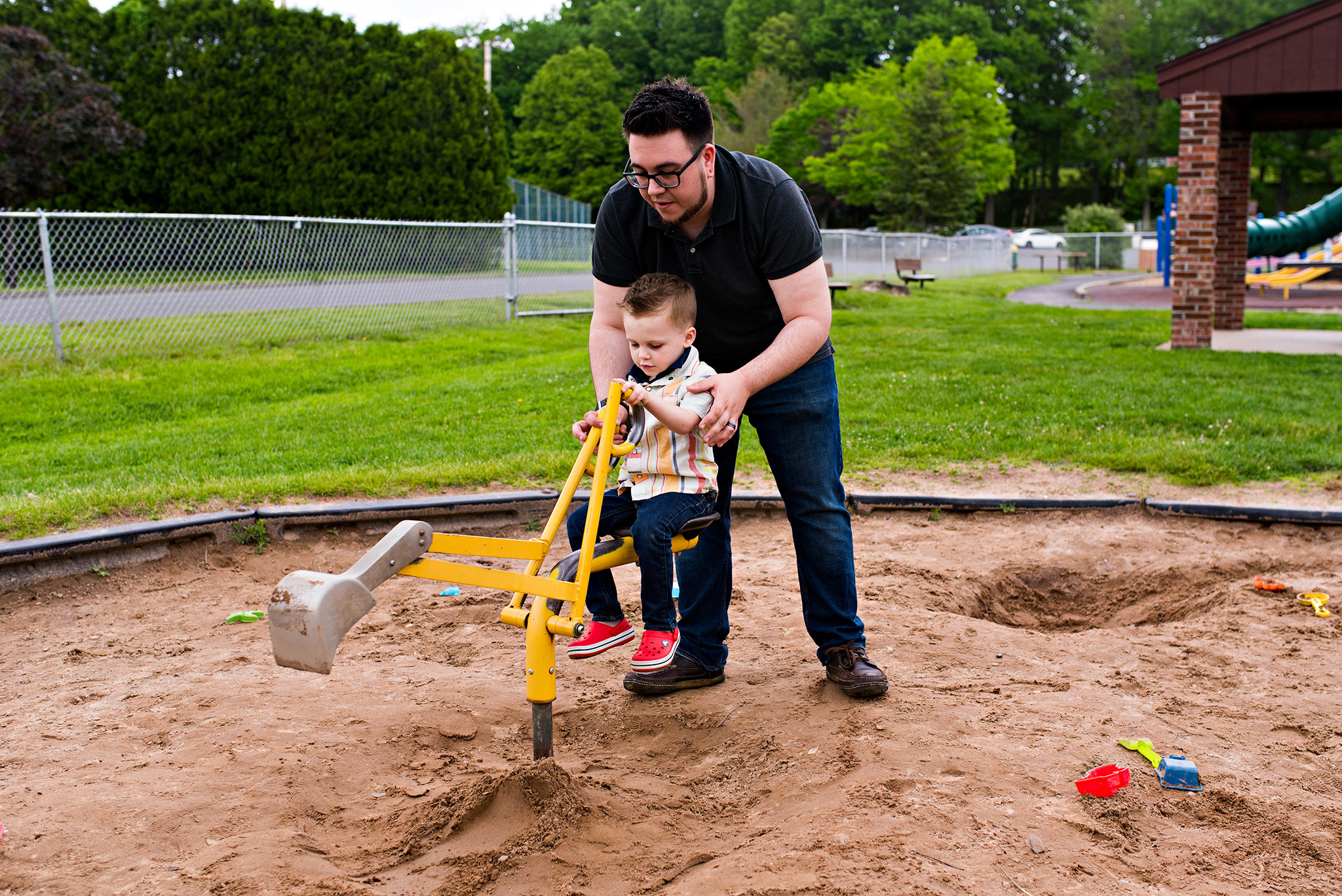 dad playing in sandbox with son documentary family photography ct