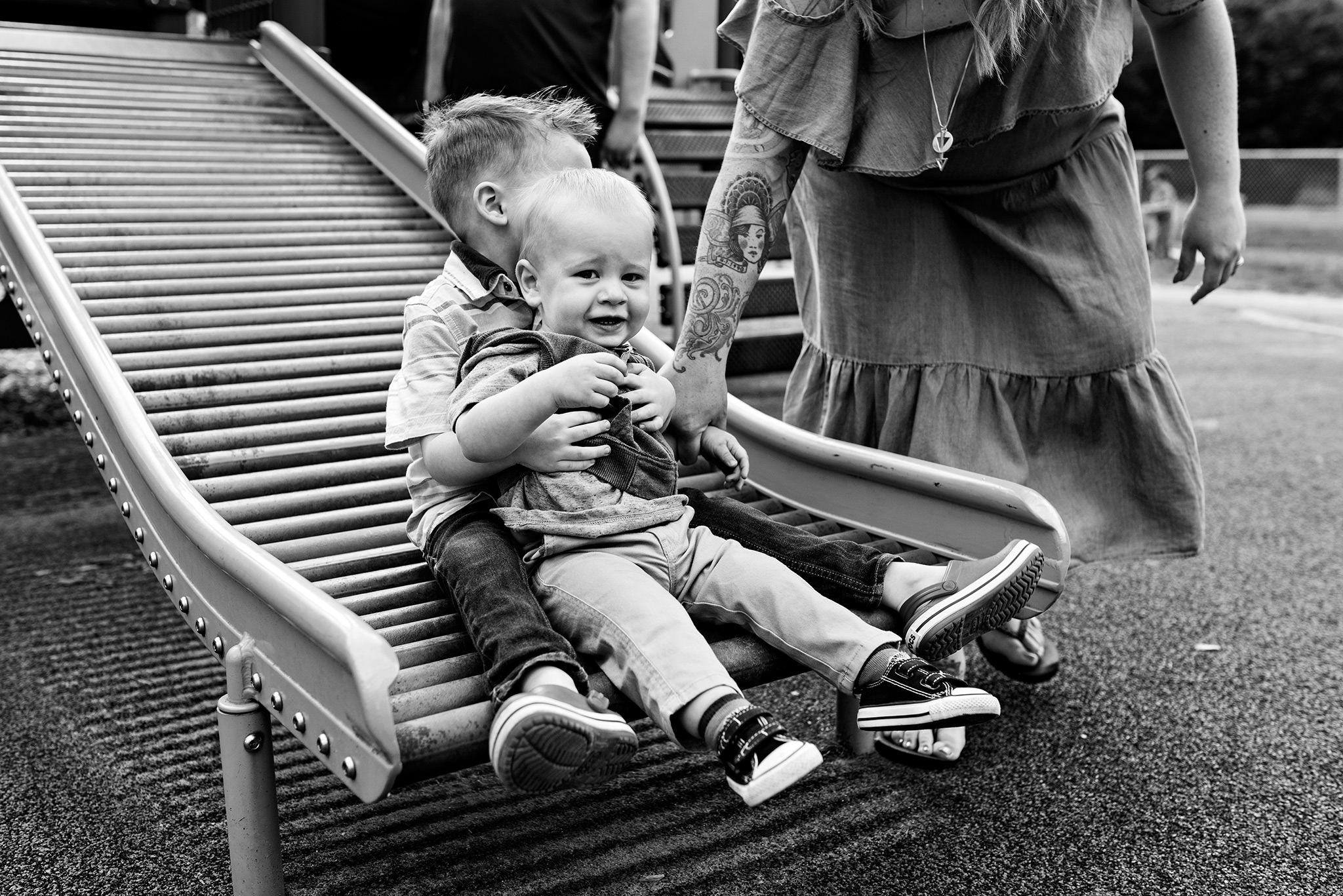 brothers on slide at park family photography ct