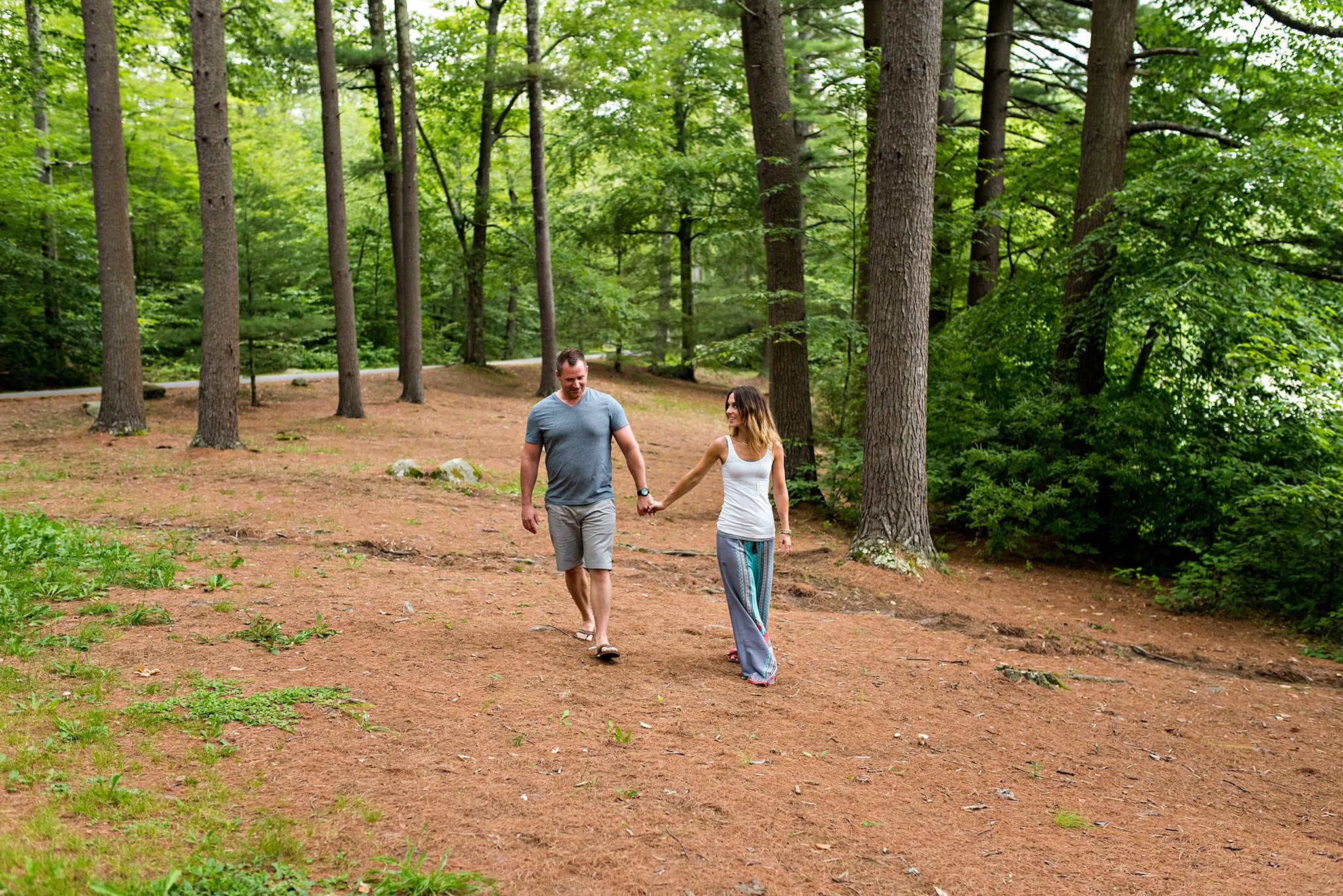 chatfield hollow elopement photography ct, husband and wife holding hands in forest