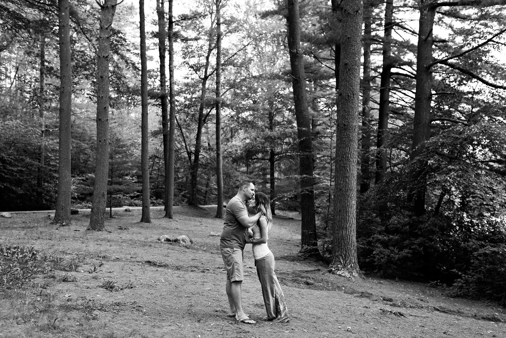 husband and wife kissing in the forest. ct elopment photogtaphy 