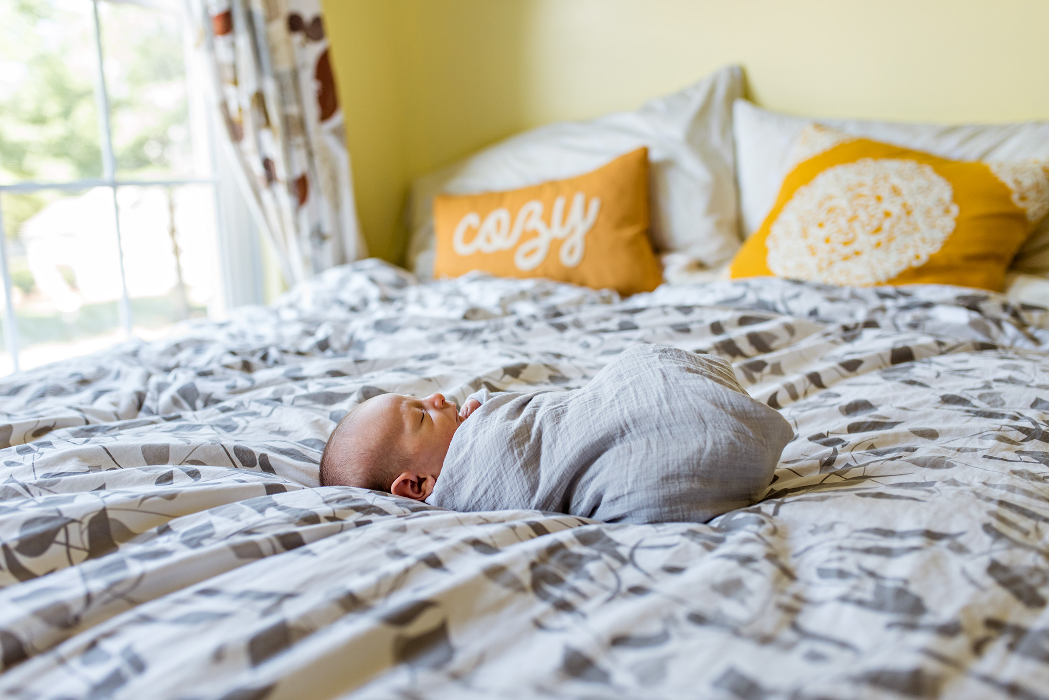 newborn swaddled on bed. newborn photography ct