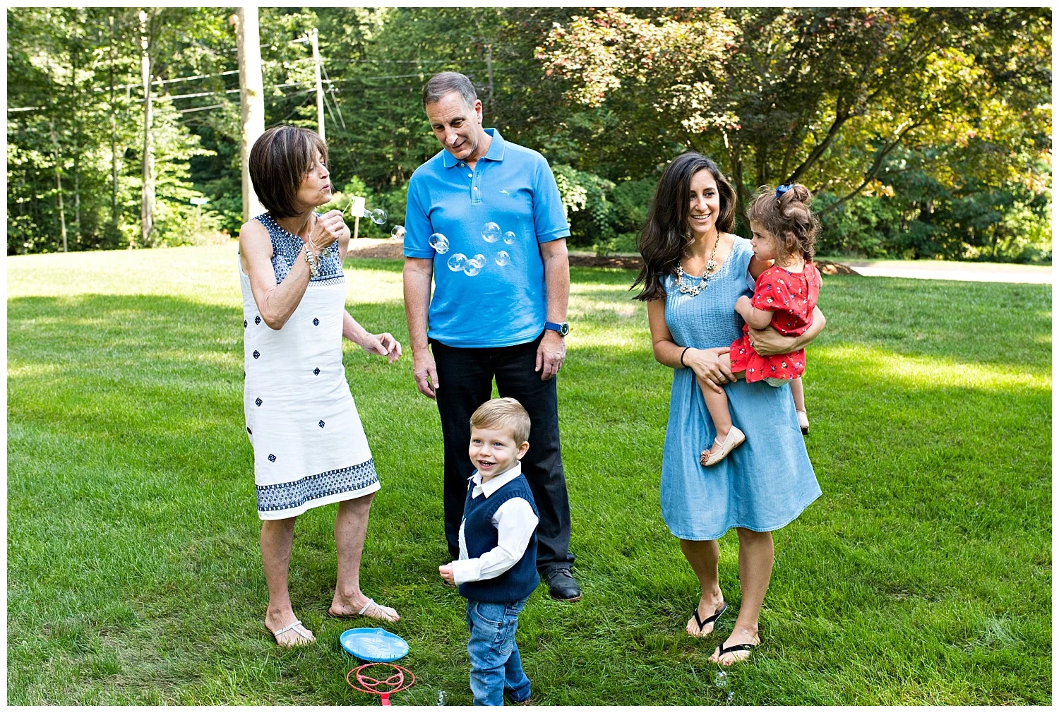 large family photography blowing bubbles with grandma fairfield county photographer