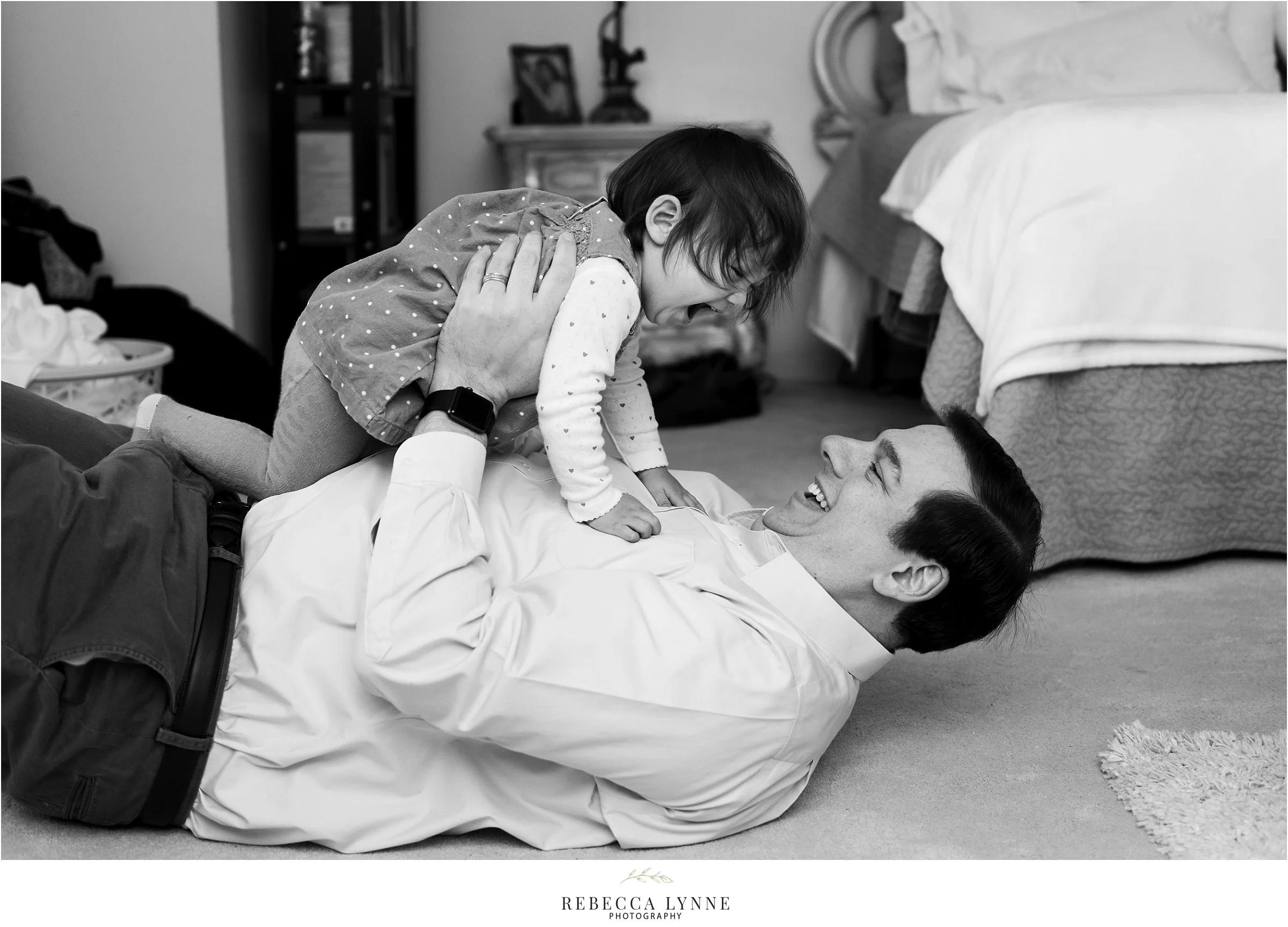 dad playing with daughter. in home photos. maternity pictures ct