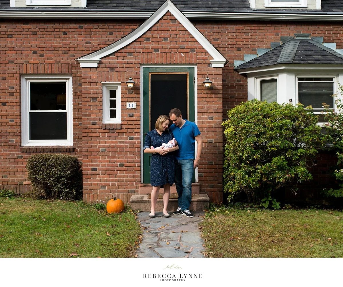 lifestyle newborn photography in front of family's home