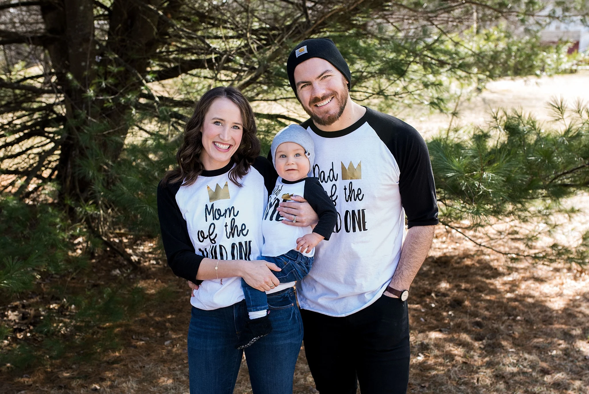 mom and dad with baby at 1st birthday party