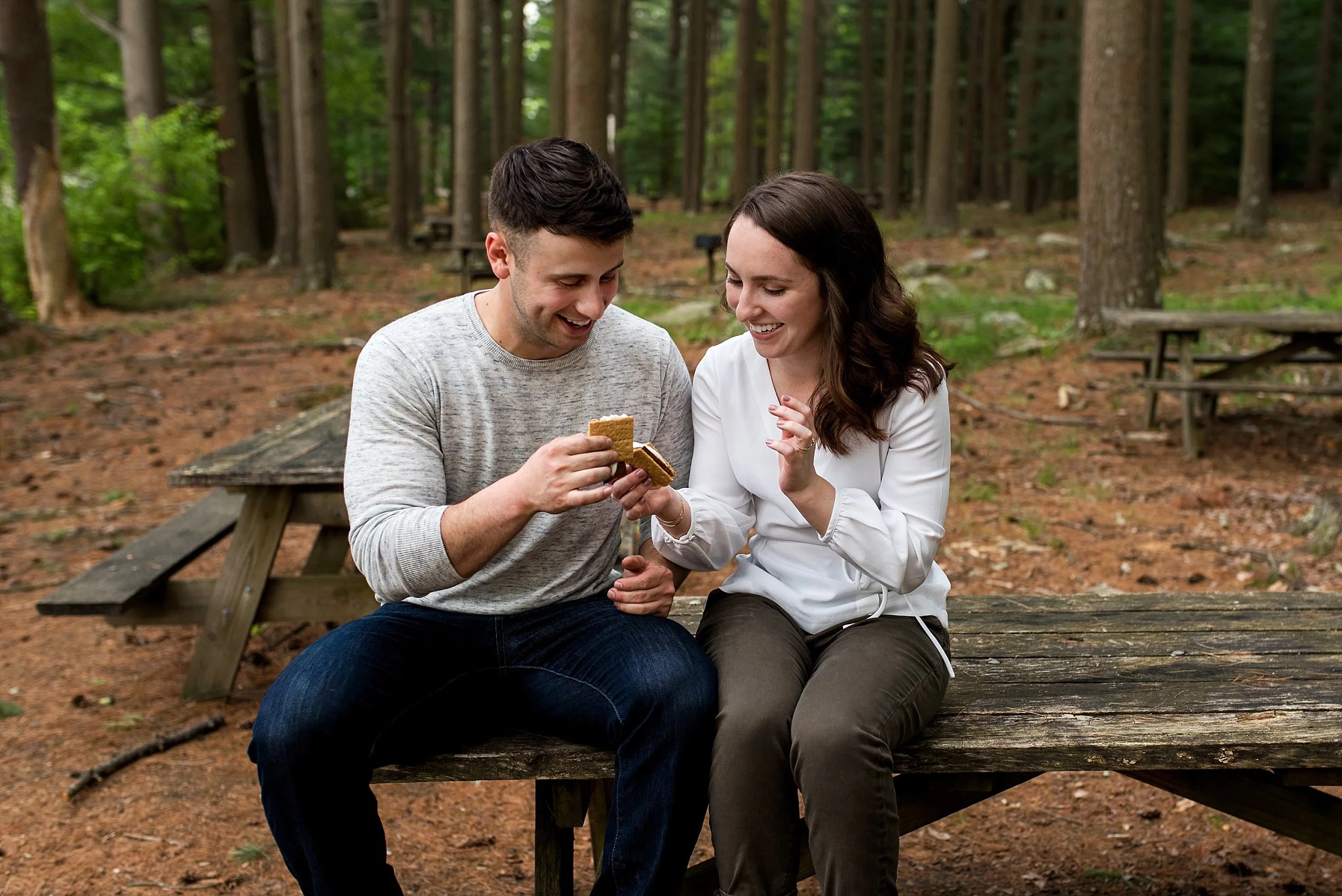 ct engagement photography eating s'mores in the woods