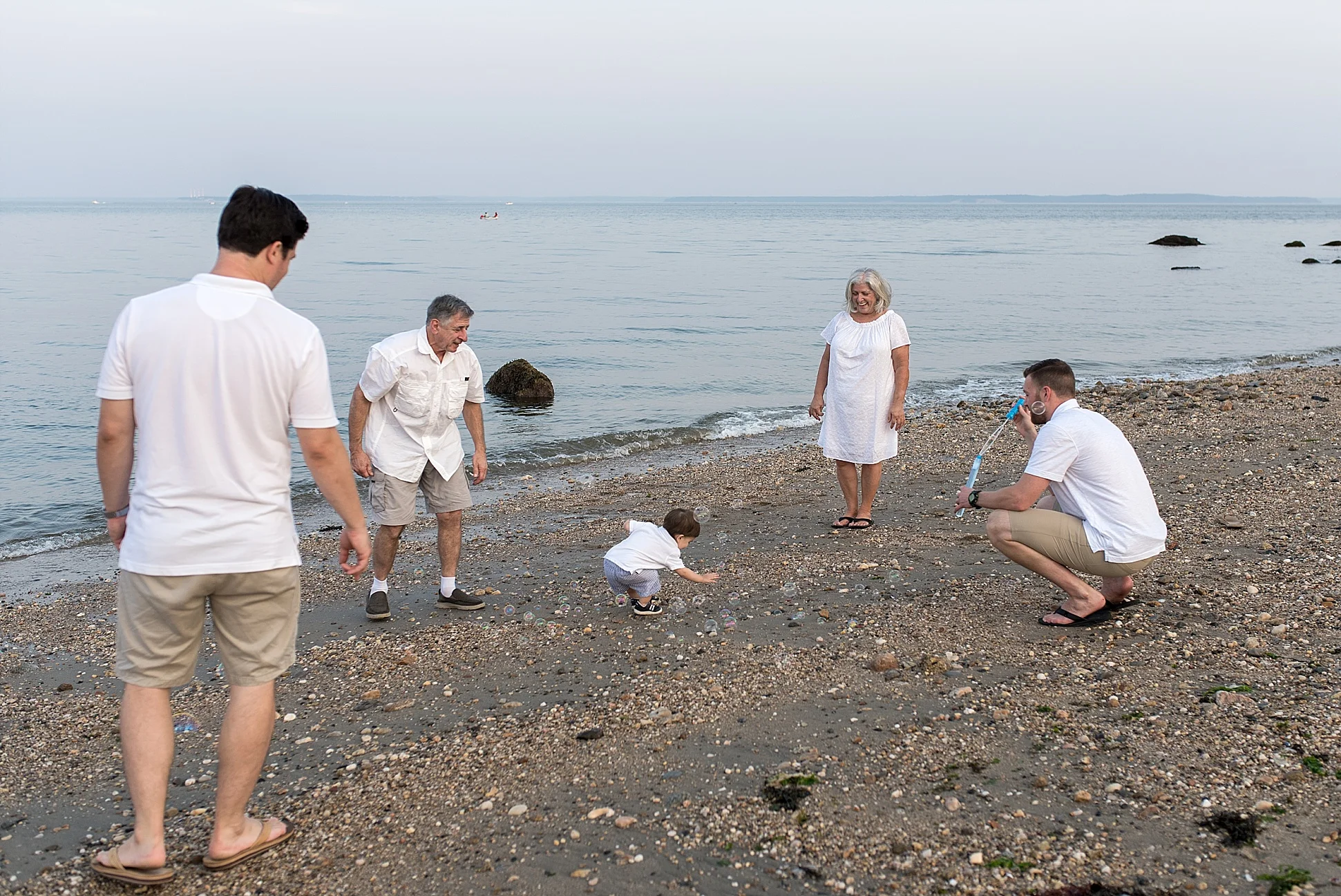 large family photography session on the beach in ct