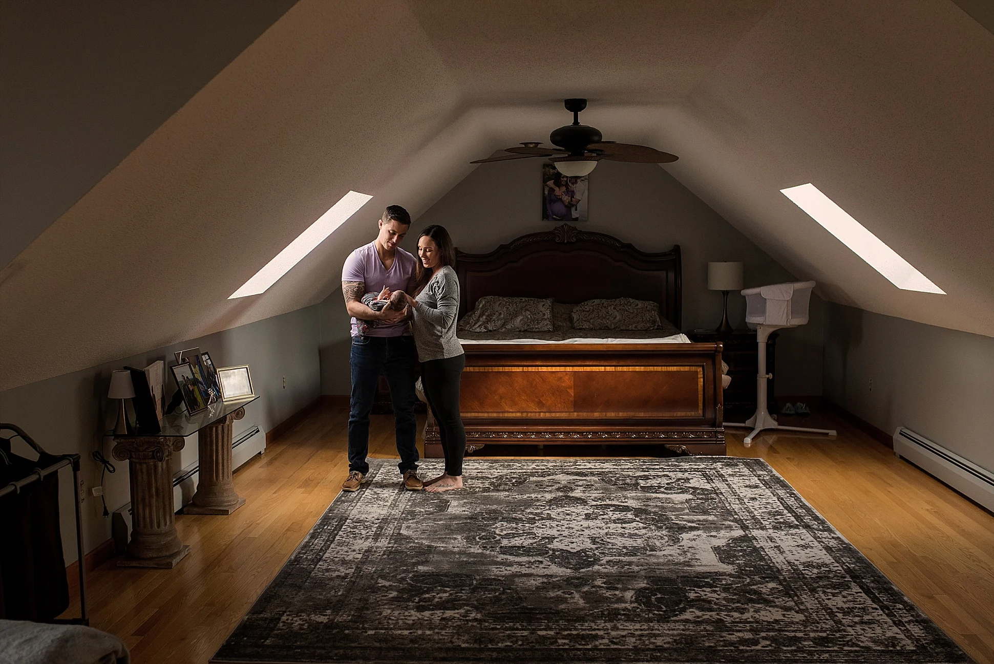 mom and dad with newborn daughter at home photography in CT
