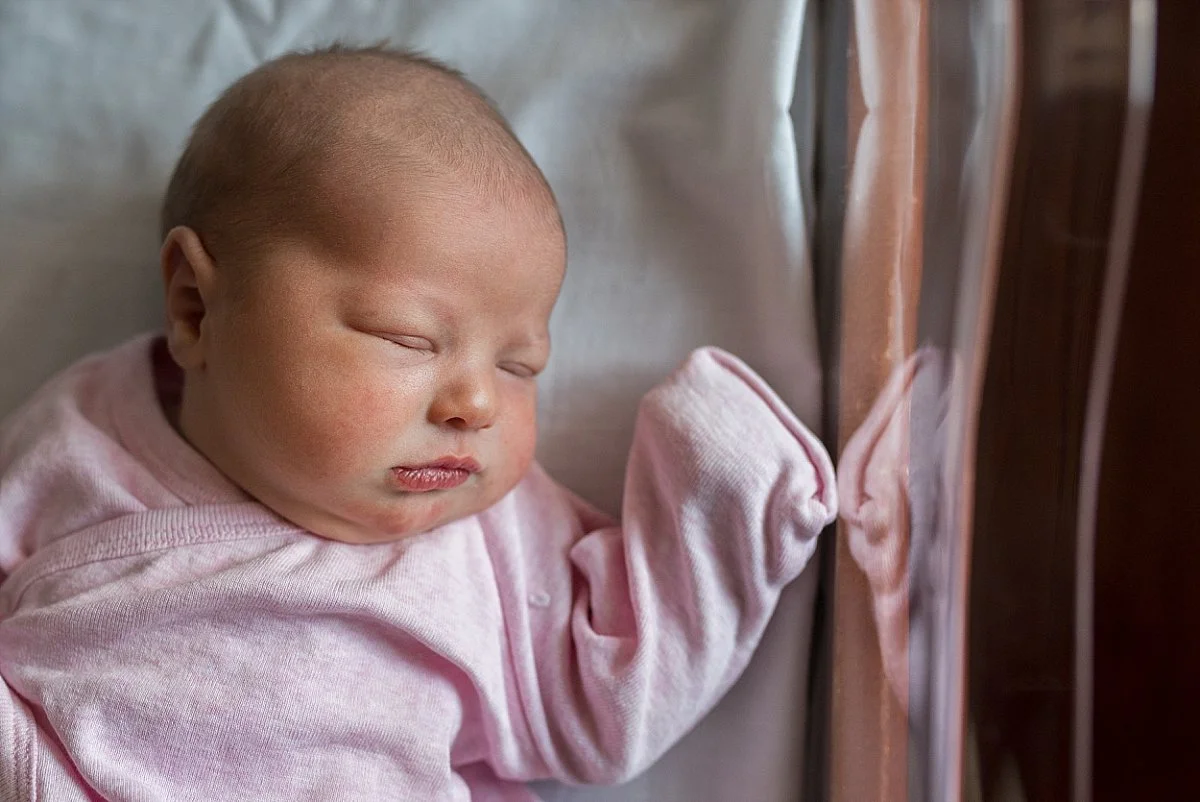 infant girl in hospital bassinet. newborn photography CT