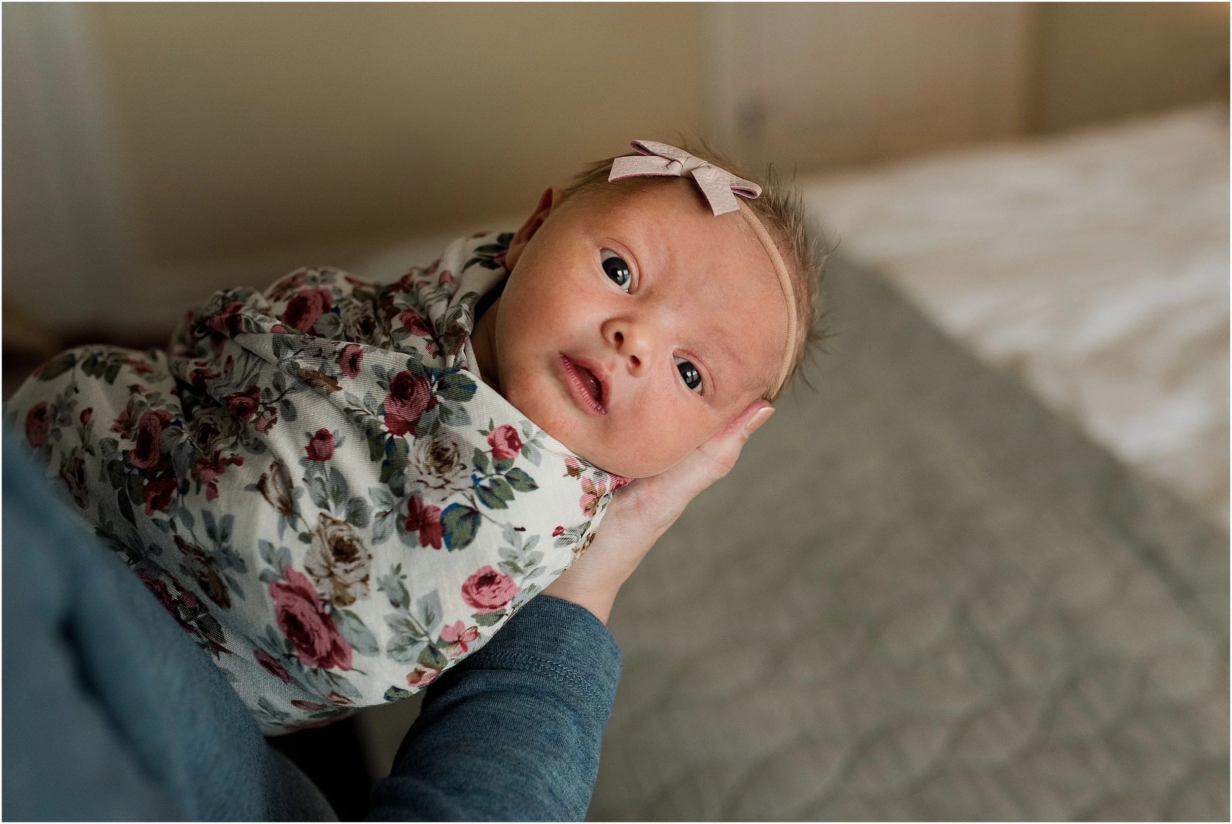 Newborn baby girl during an in home newborn photography session in CT