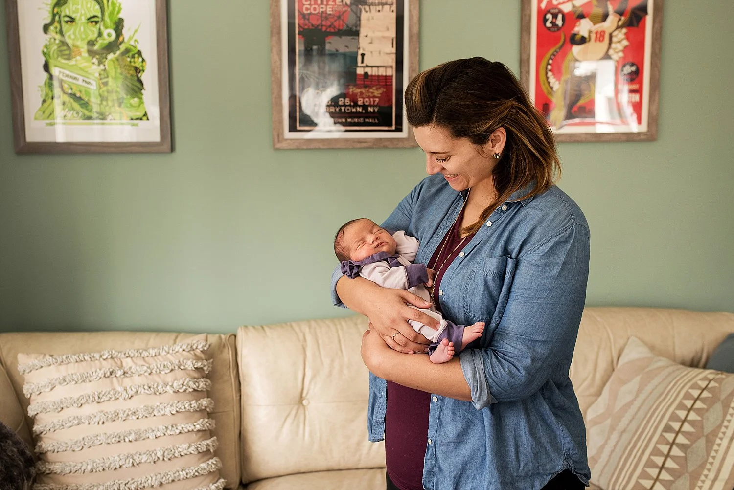New mom holding her baby girl during their ct newborn photography