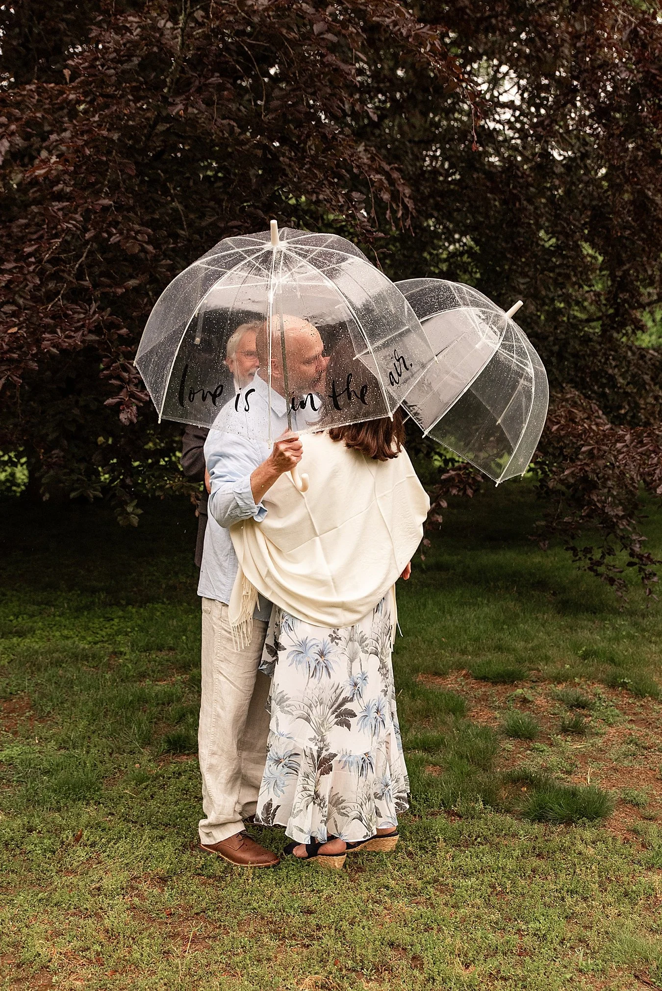 first kiss in the rain of backyard elopement in CT