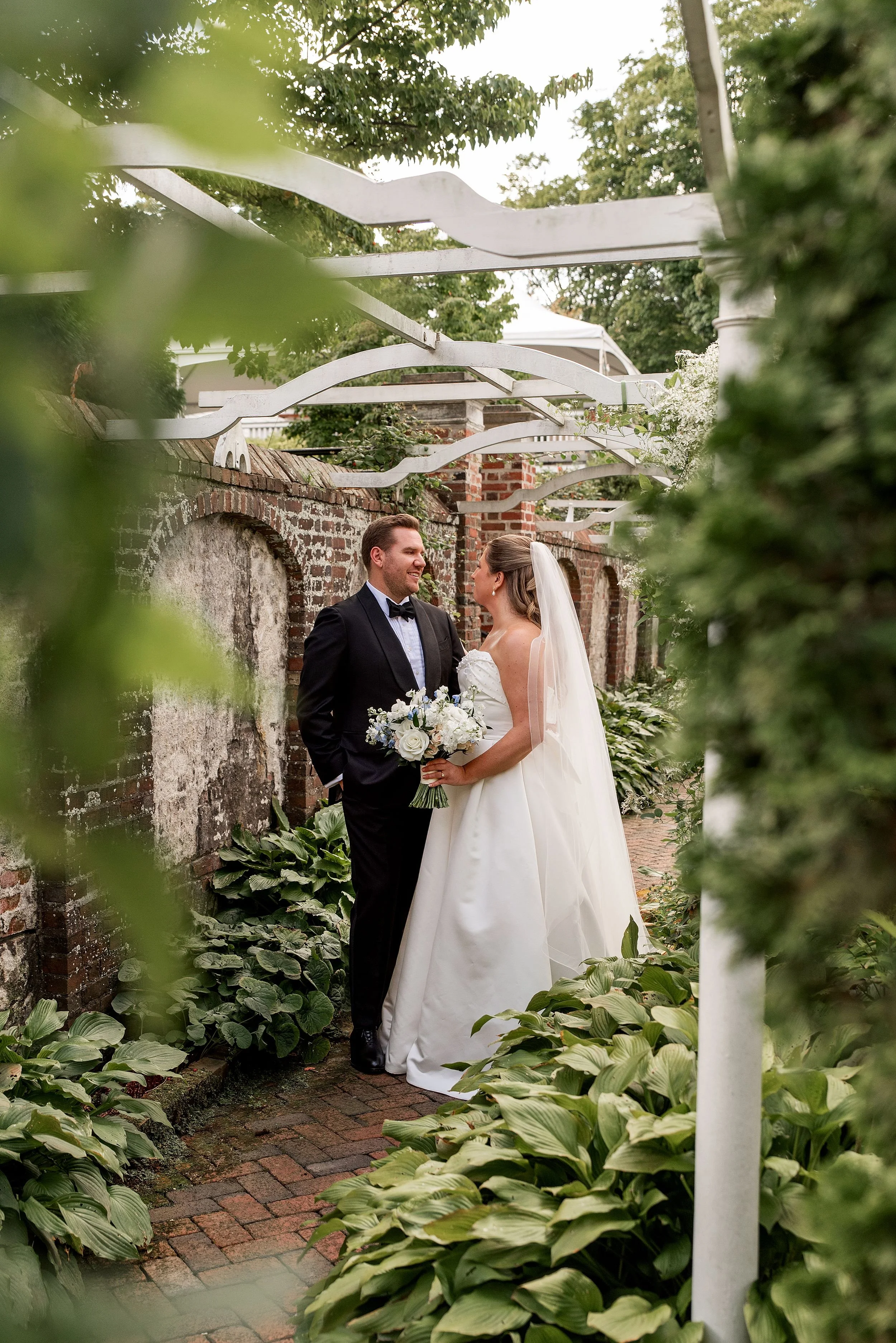 Wedding photographer Rebecca Lynne captures portrait of bride in groom in sunken garden wedding in Ridgefield, CT