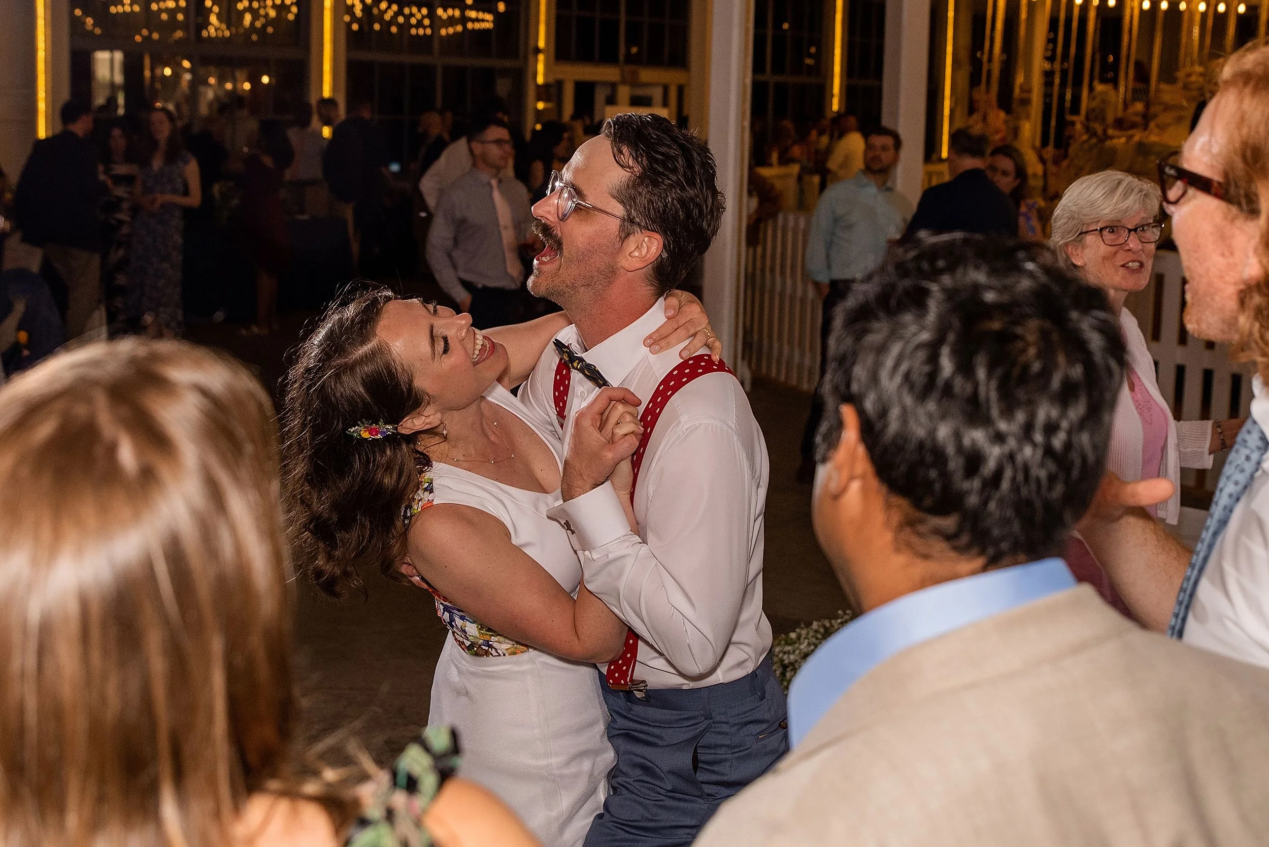 bride and groom dancing together at reception at The Carousel at Lighthouse Point Park in New Haven, CT wedding