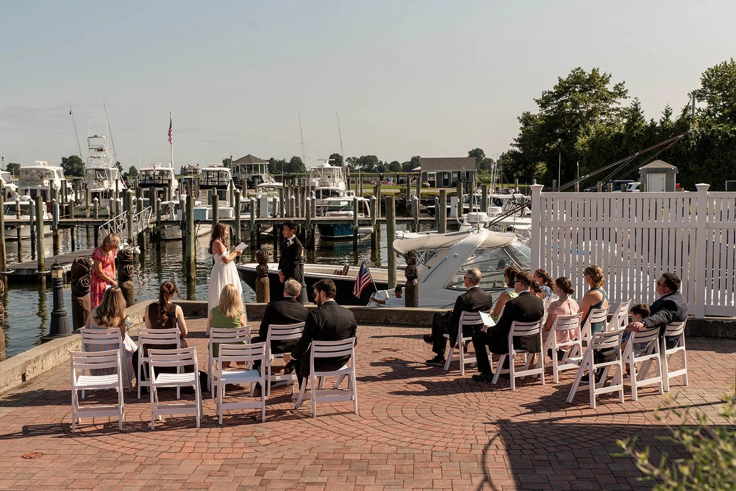 Bride reading vows during wedding ceremony at Saybrook Point Inn in Old Saybrook, CT