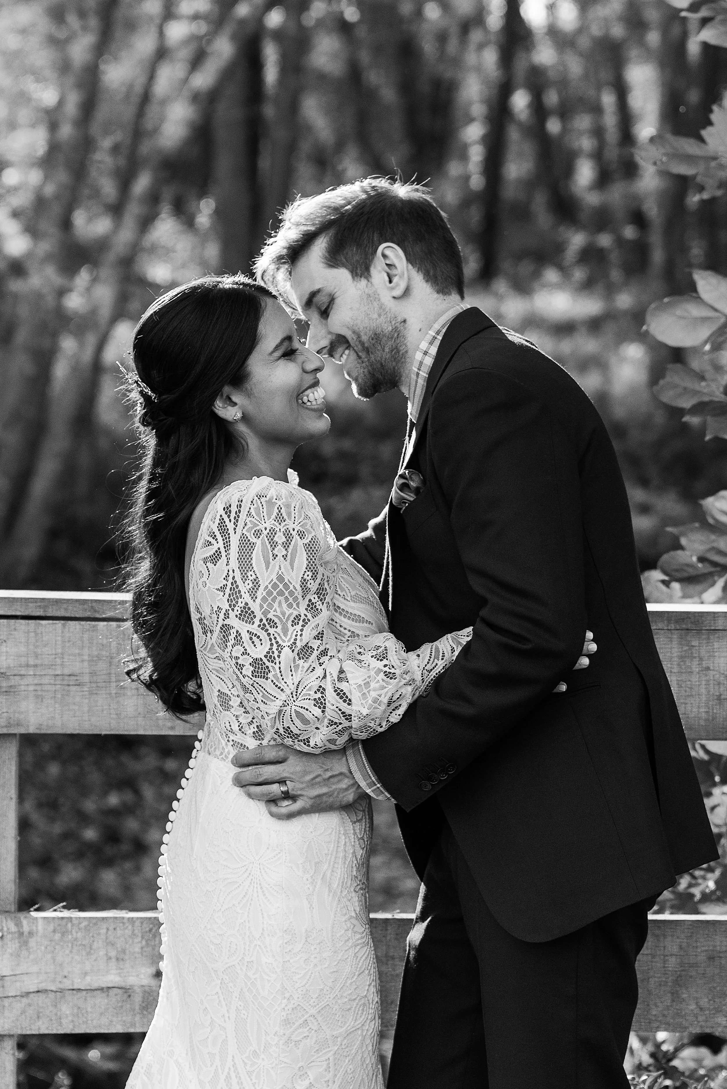 black and white wedding portrait of bride and groom laughing together at CT micro wedding