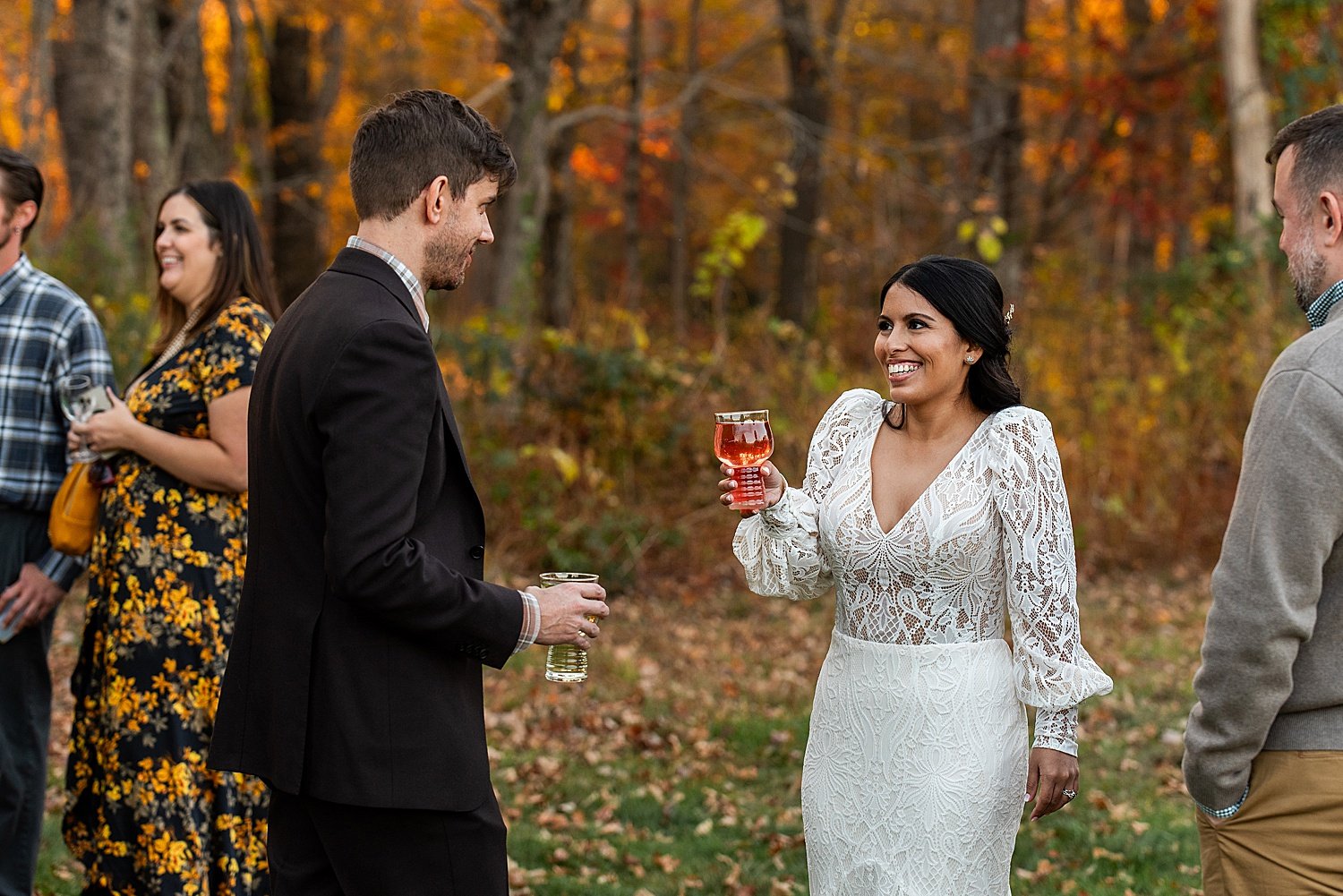 bride and groom sharing a hard cider during the micro wedding reception a