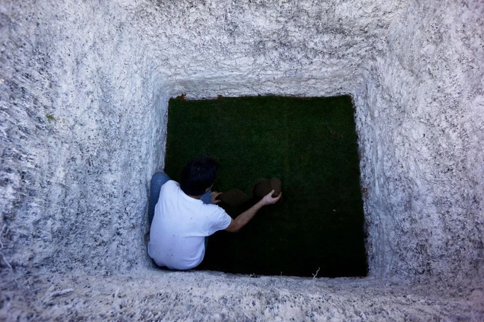 Preparing the hole for burial.