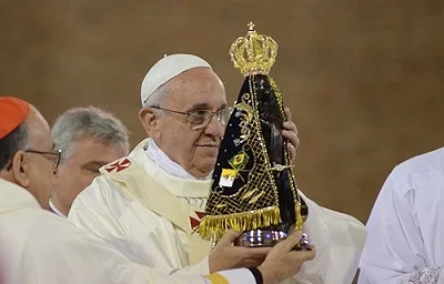 Pope_Francis_holds_a_Statue_of_Our_Lady_at_the_National_Shrine_of_Our_Lady_of_Aparecida_July_24_Credit_Ronaldo_Correa_via_JMJ_Rio_2013_Flickr_CC_BY_NC_SA_.jpg