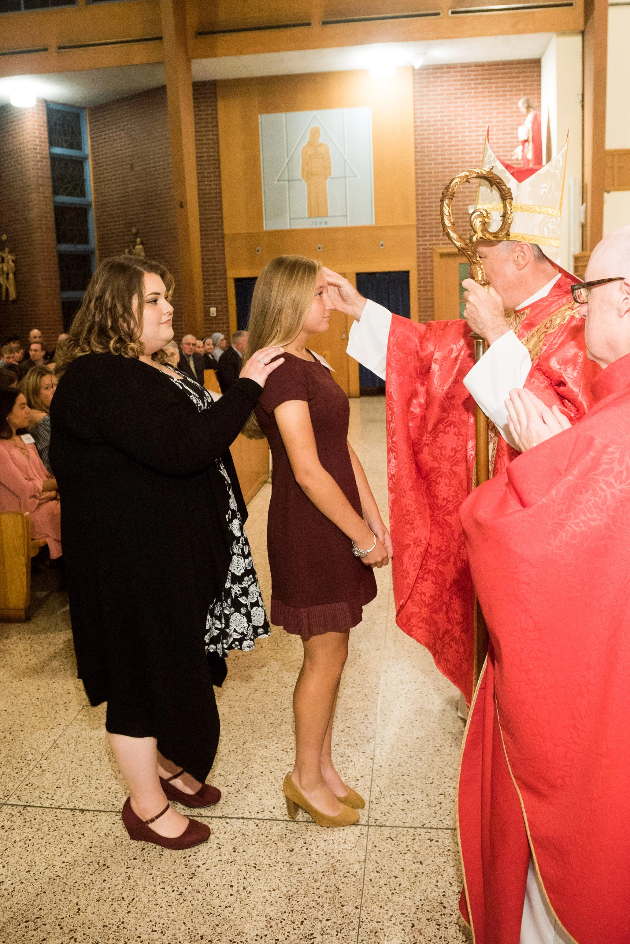 Catherine Clements is confirmed by Bishop Checchio.