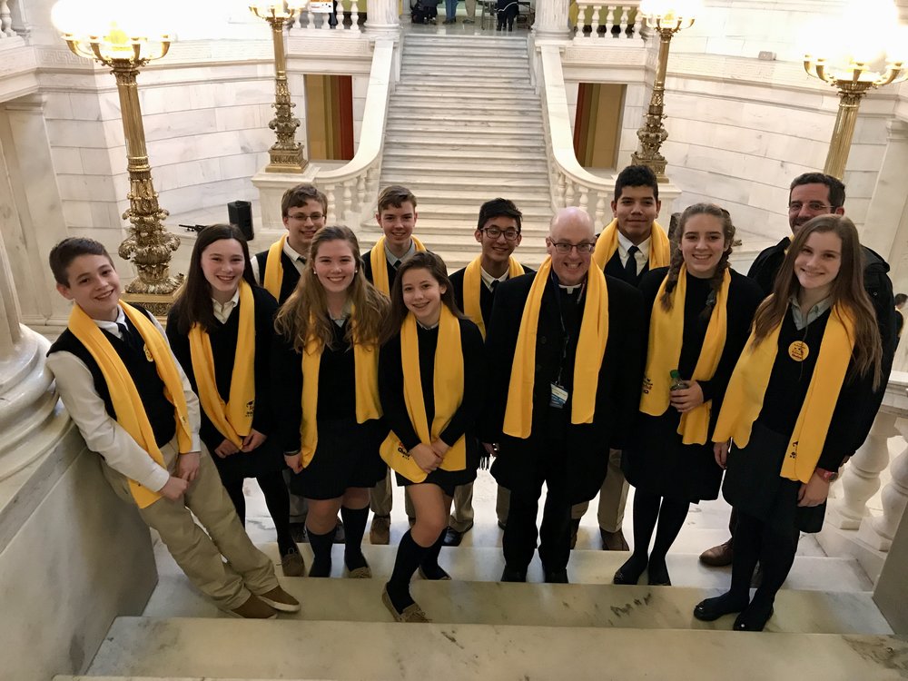 OLM School students and Fr. Healey advocate for School Choice programs at the RI Statehouse.
