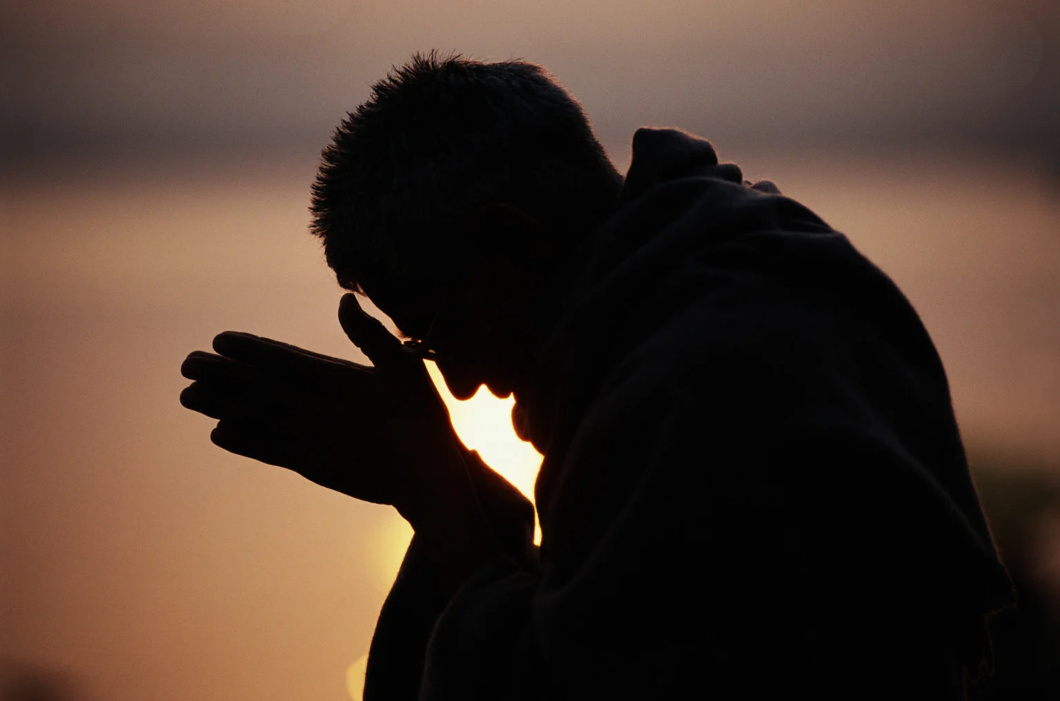 o-PRIEST-PRAYING-facebook.jpg