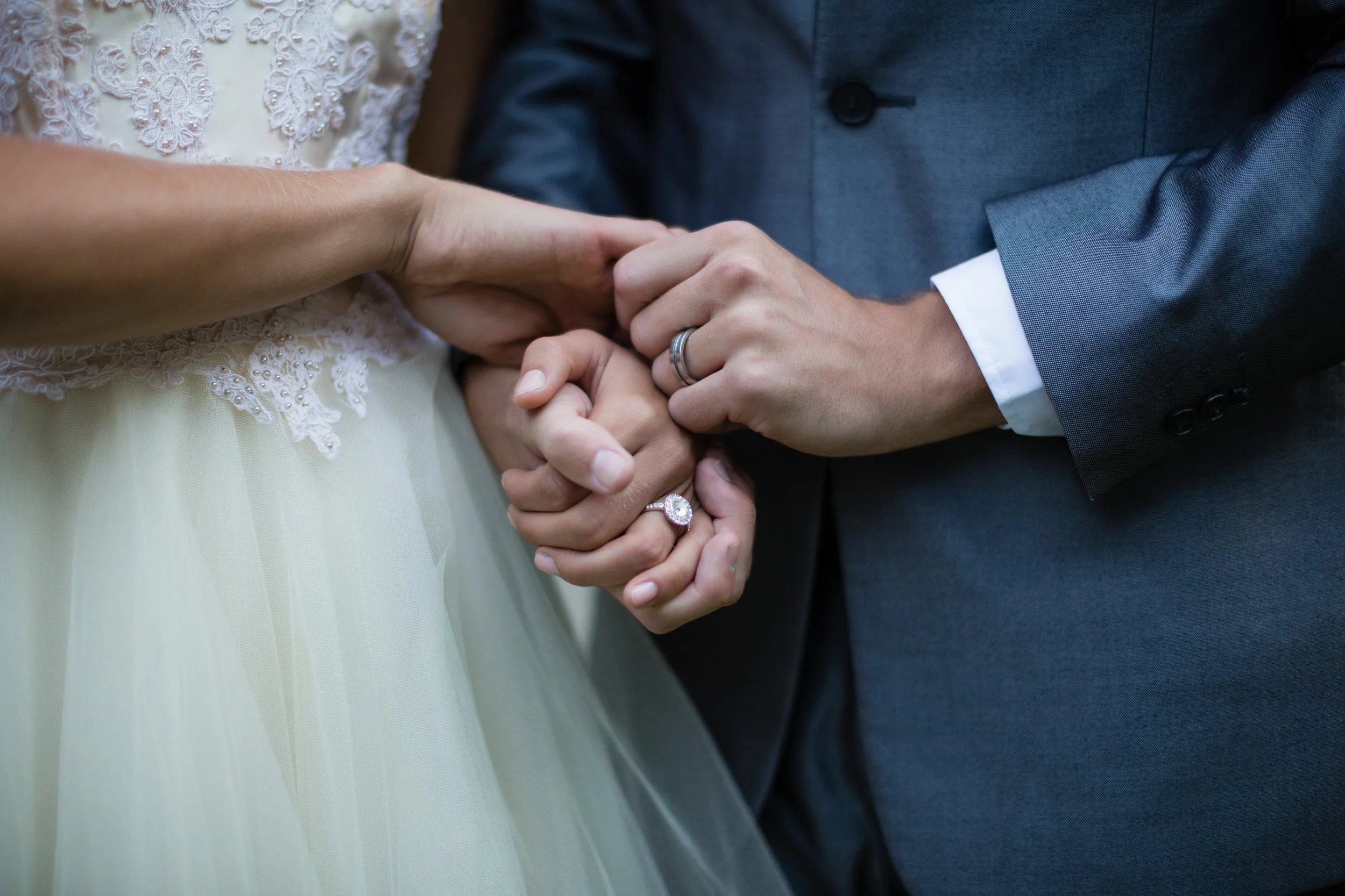 wedding-couple-holding-hands-XU6KSMC.jpg