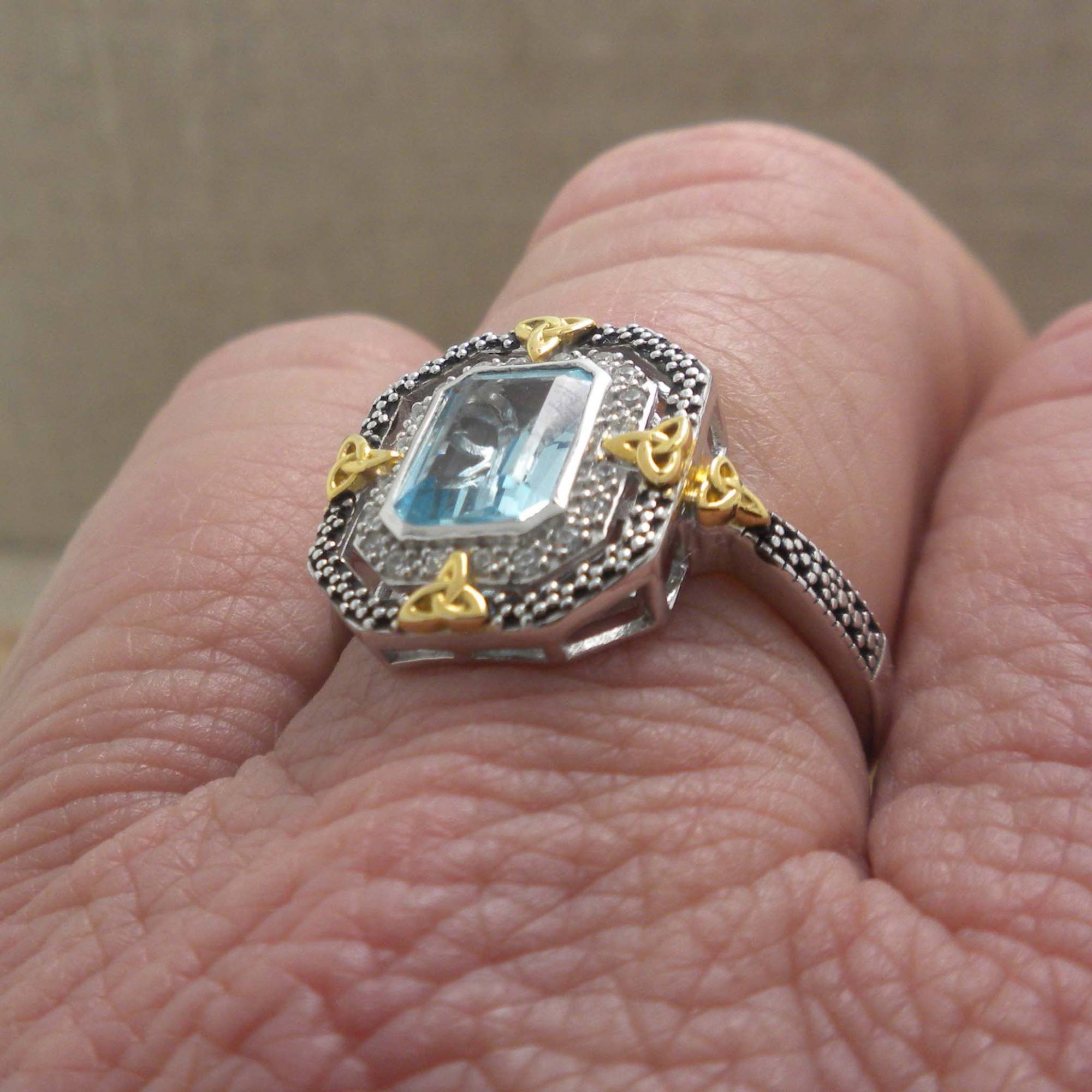 Sterling Silver and 10K Trinity Knot ring with Blue Topaz
