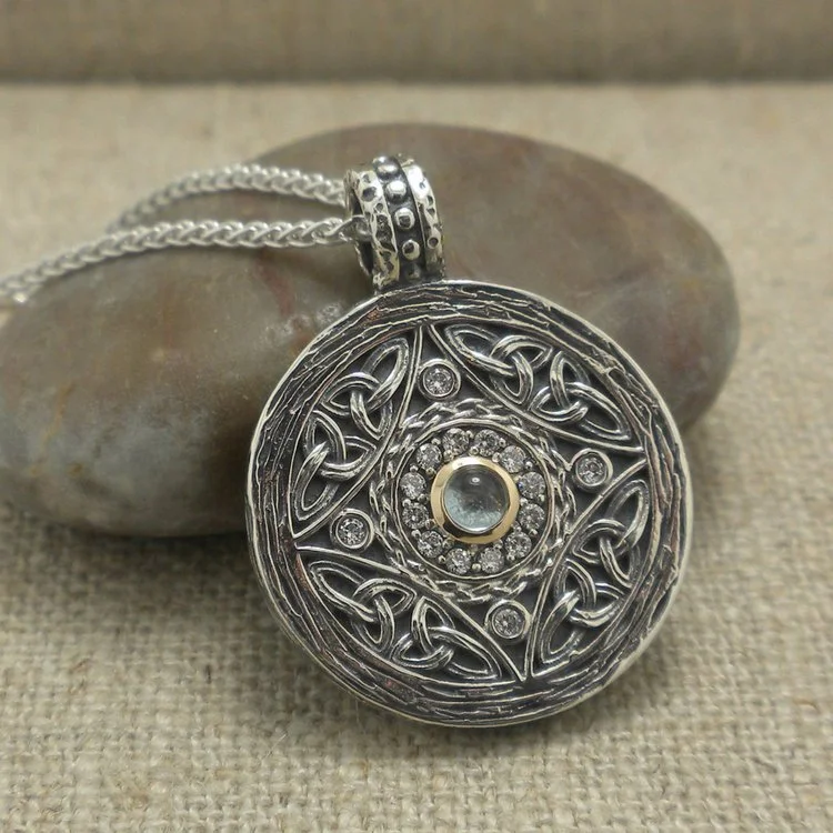 Sterling Silver and 10K Shield Pendant with CZs and Cabochon Cut Blue Topaz