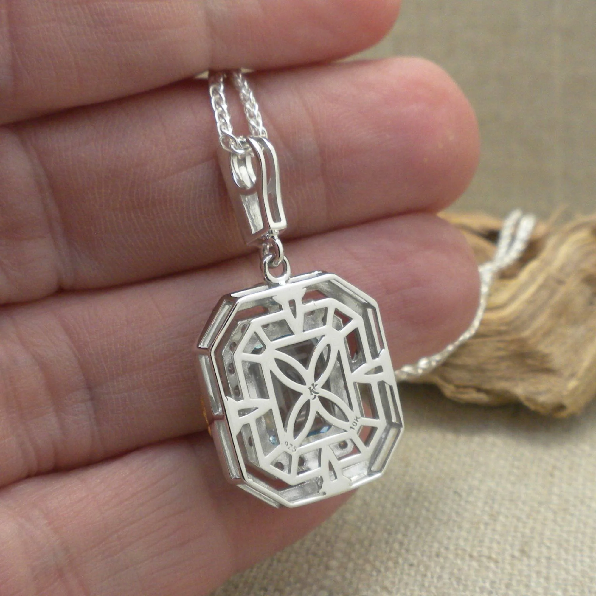 back of Sterling Silver &amp; 10K Octagon Celestial Pendant with Trinity Knots &amp; Blue Topaz