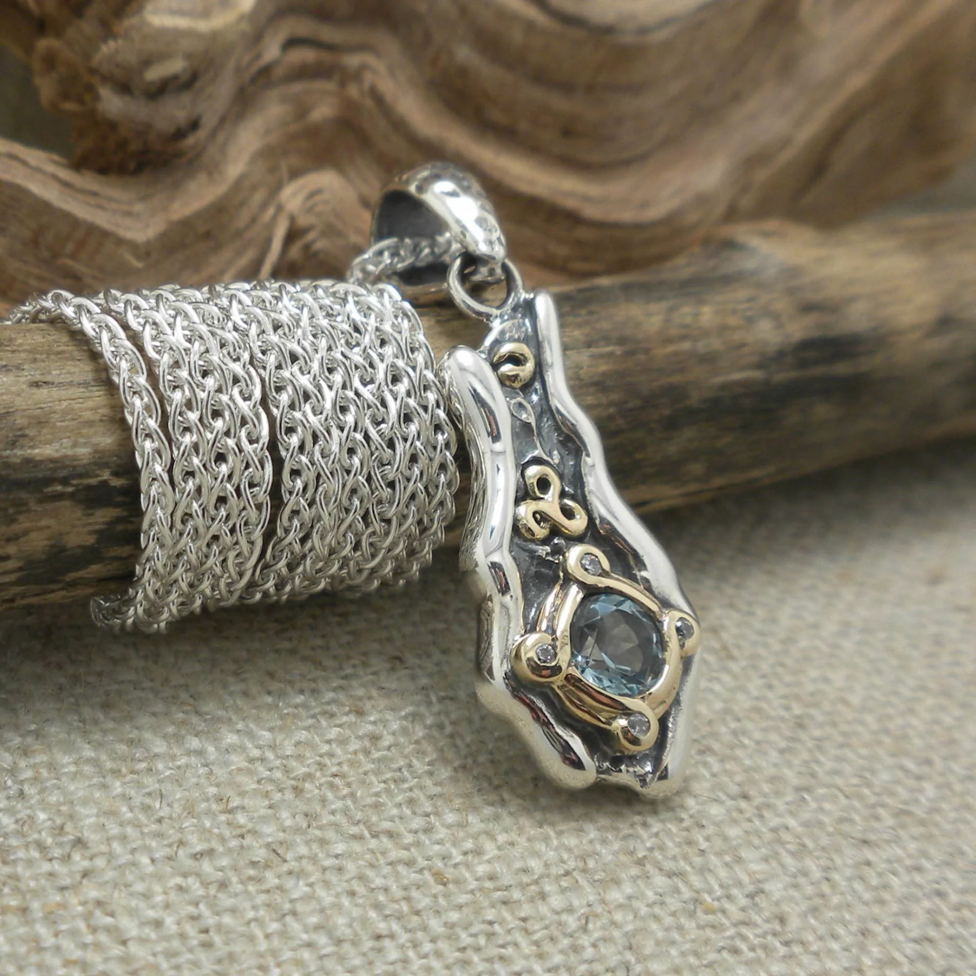 Sterling Silver and 10K Eddy Pendant with Sky Blue Topaz &amp; Celtic Spiral Accent