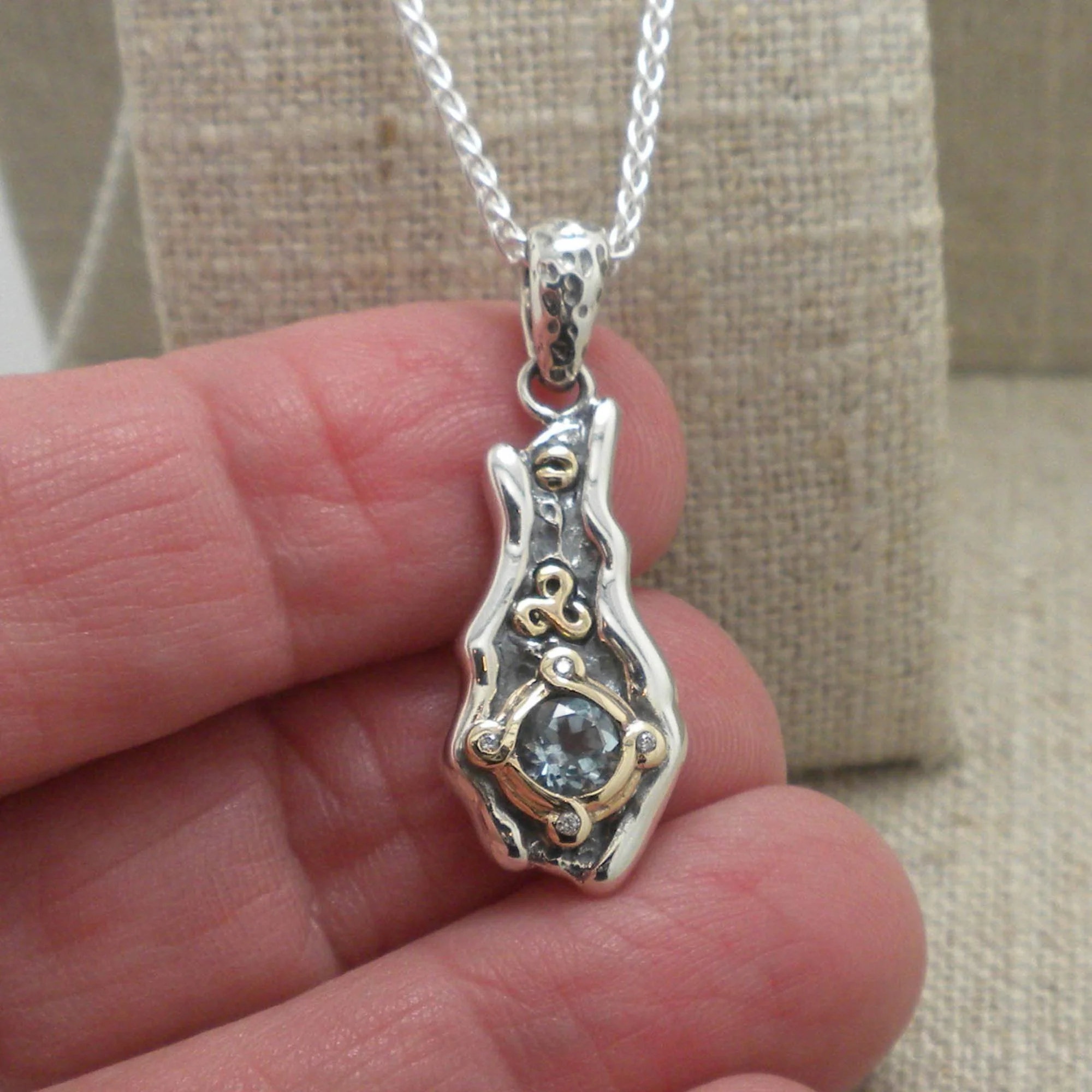 Eddy Pendant with Sky Blue Topaz &amp; Celtic Spiral Accent