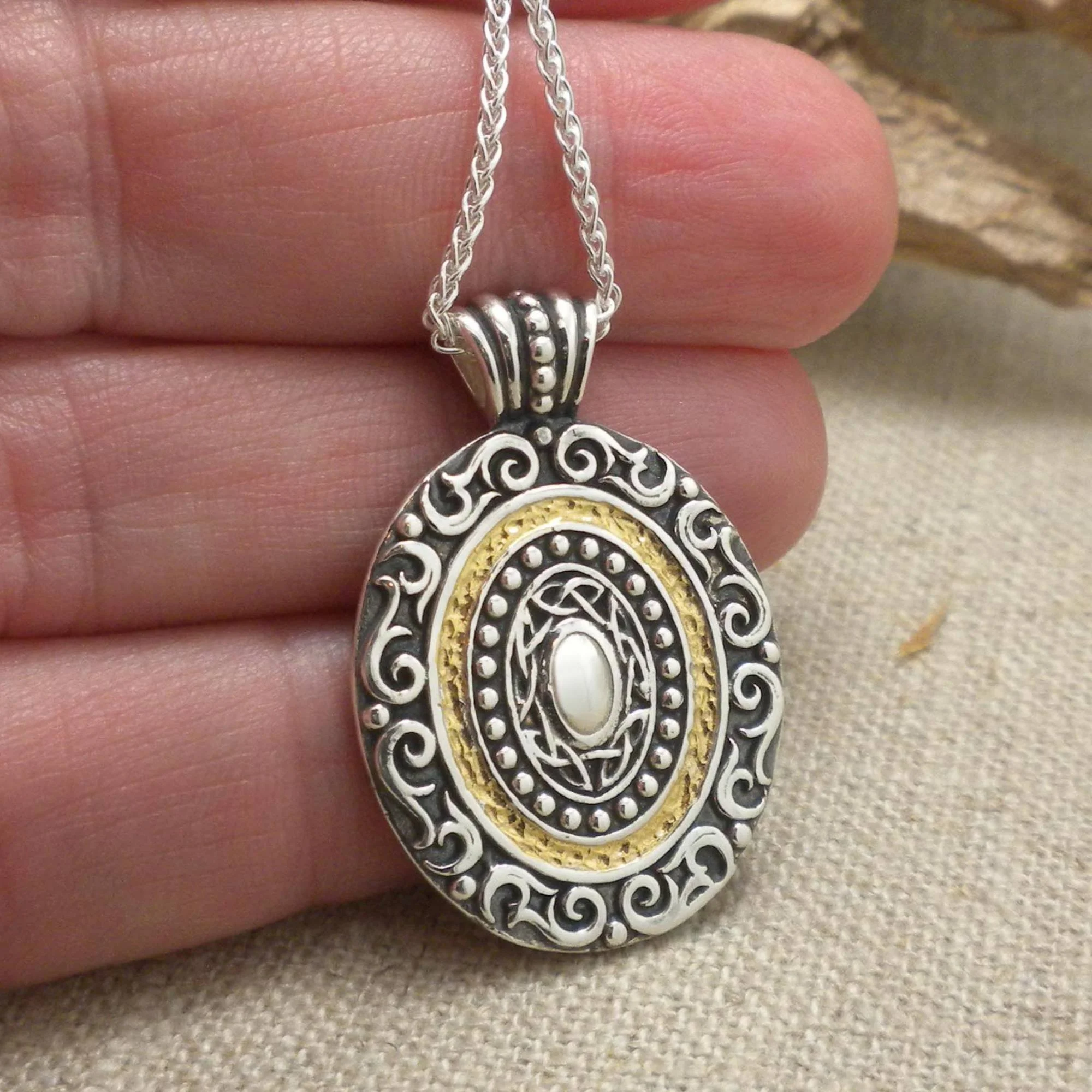 Sterling Silver and 14K Gilding Shield Pendant by Keith Jack