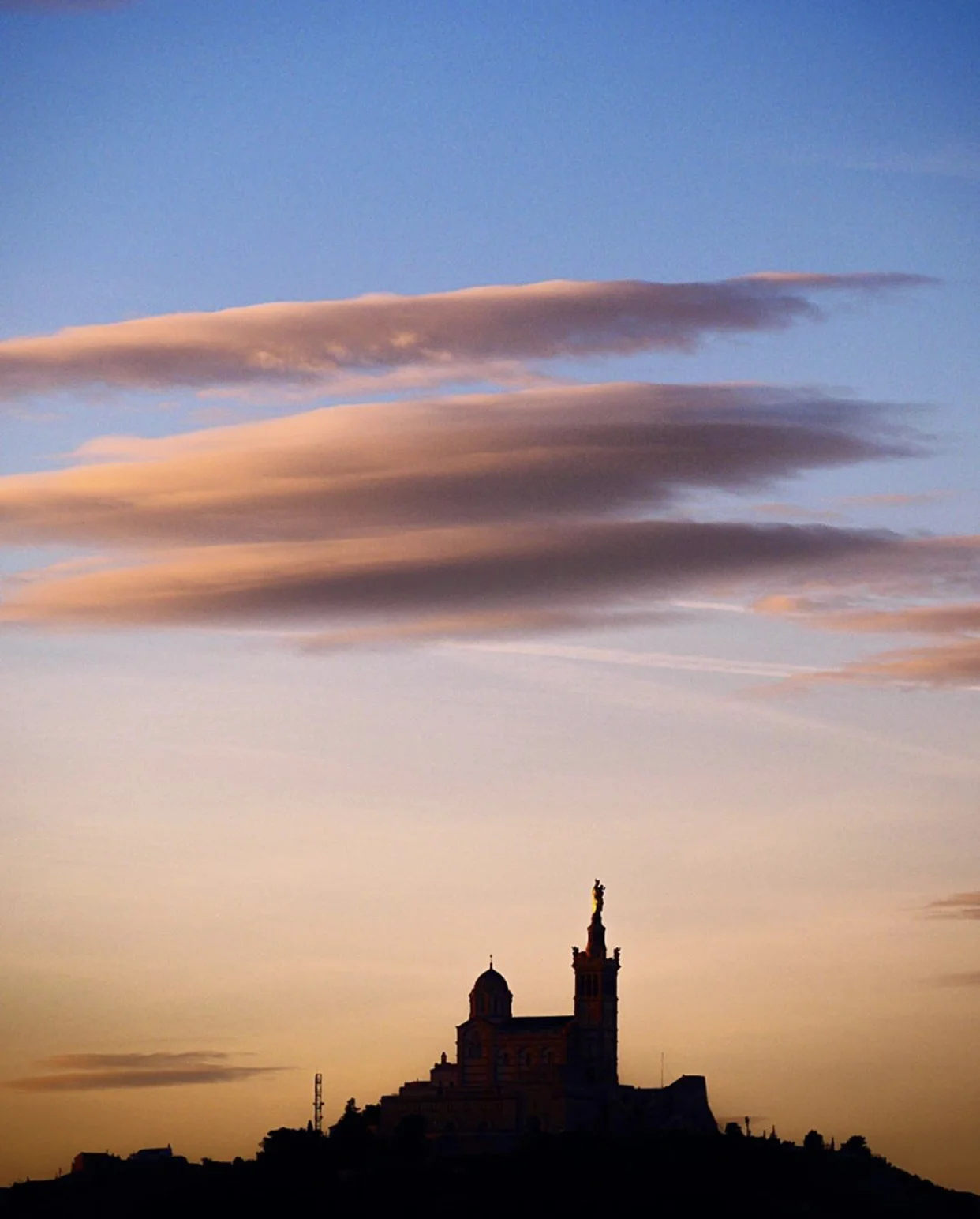 Cocktails with a view: sunset from our hotel terrace with Notre Dame de la Garde on the horizon, Marseille