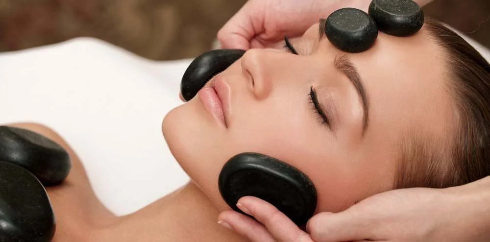 stock-photo-woman-lies-on-a-table-in-a-beauty-spa-getting-a-treatment-86826973.jpg