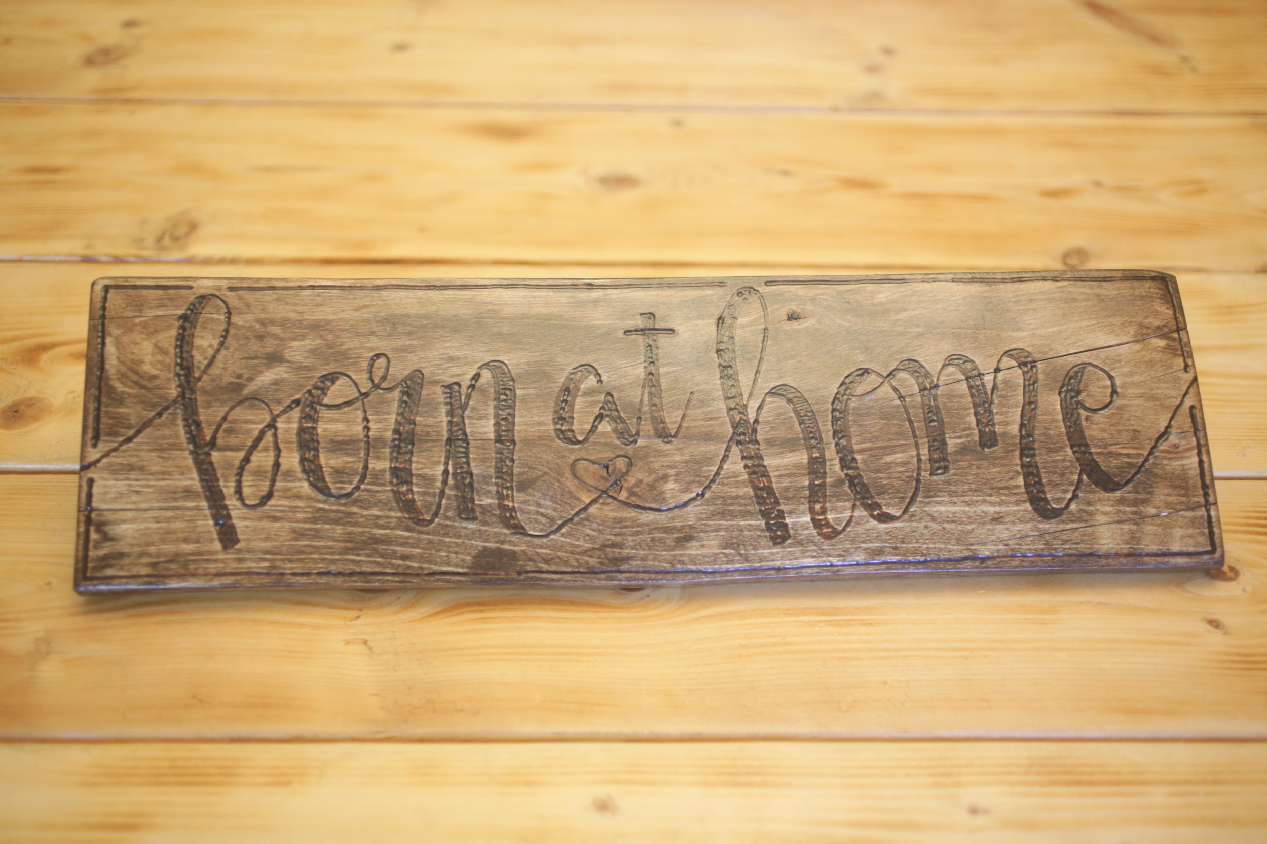 ​Wood burned sign donated by: CDE Artistry