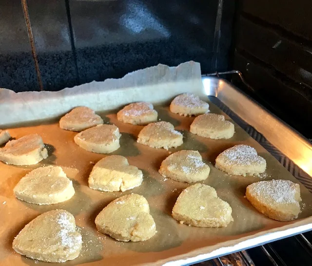 coconut cut out cookies in oven.jpg