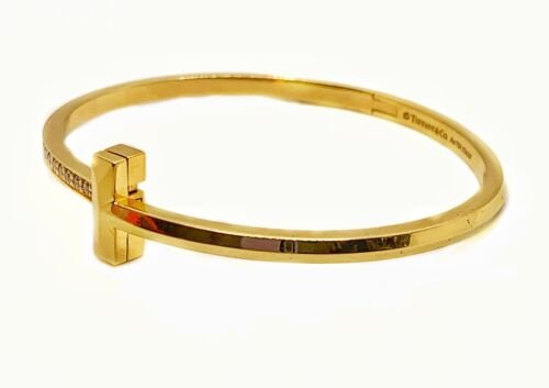 Tiffany and Co. Diamond Hinged Bangle in 18 Karat Yellow Gold For Sale at  1stDibs