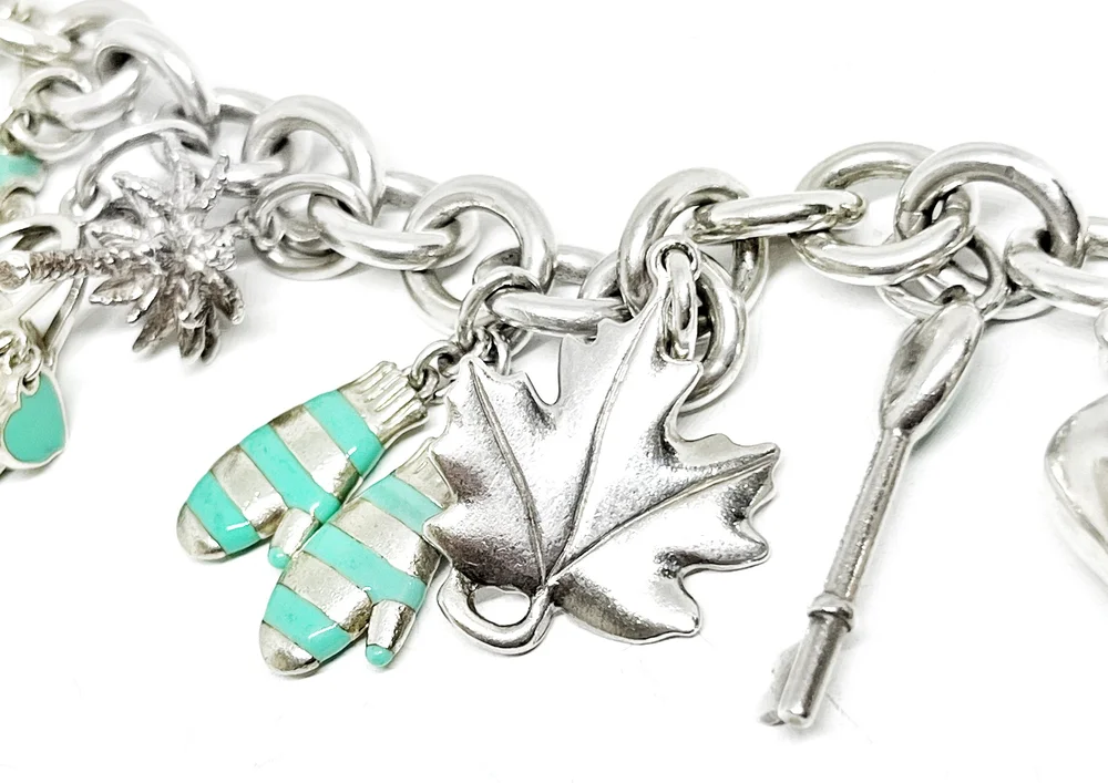 Tiffany SS 13 Charm Bracelet with Blue Enamel — DeWitt's Diamond  Gold Exchange