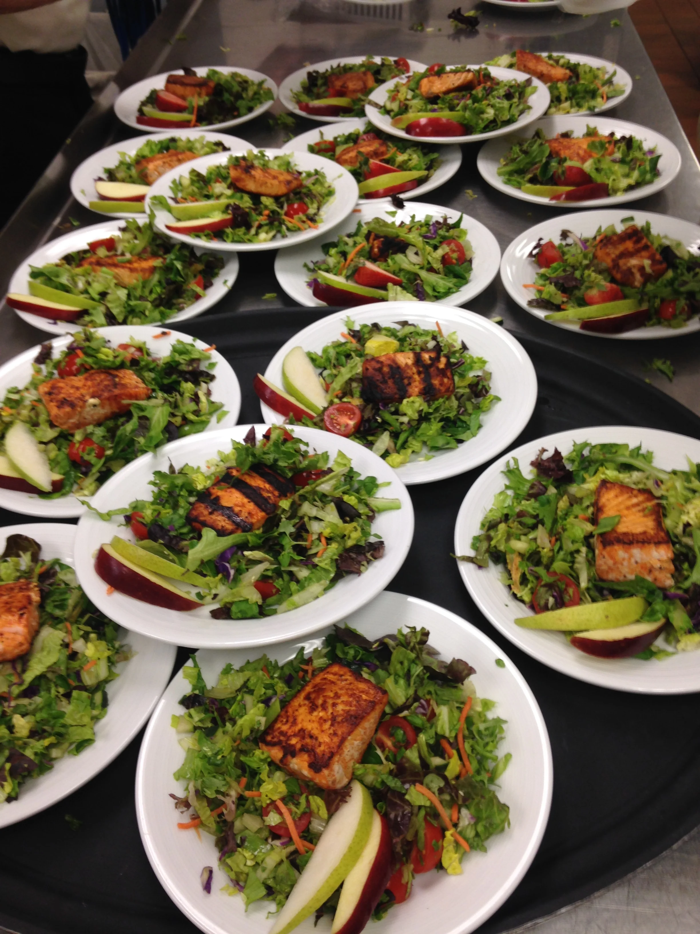 Serving salmon salad at a luncheon
