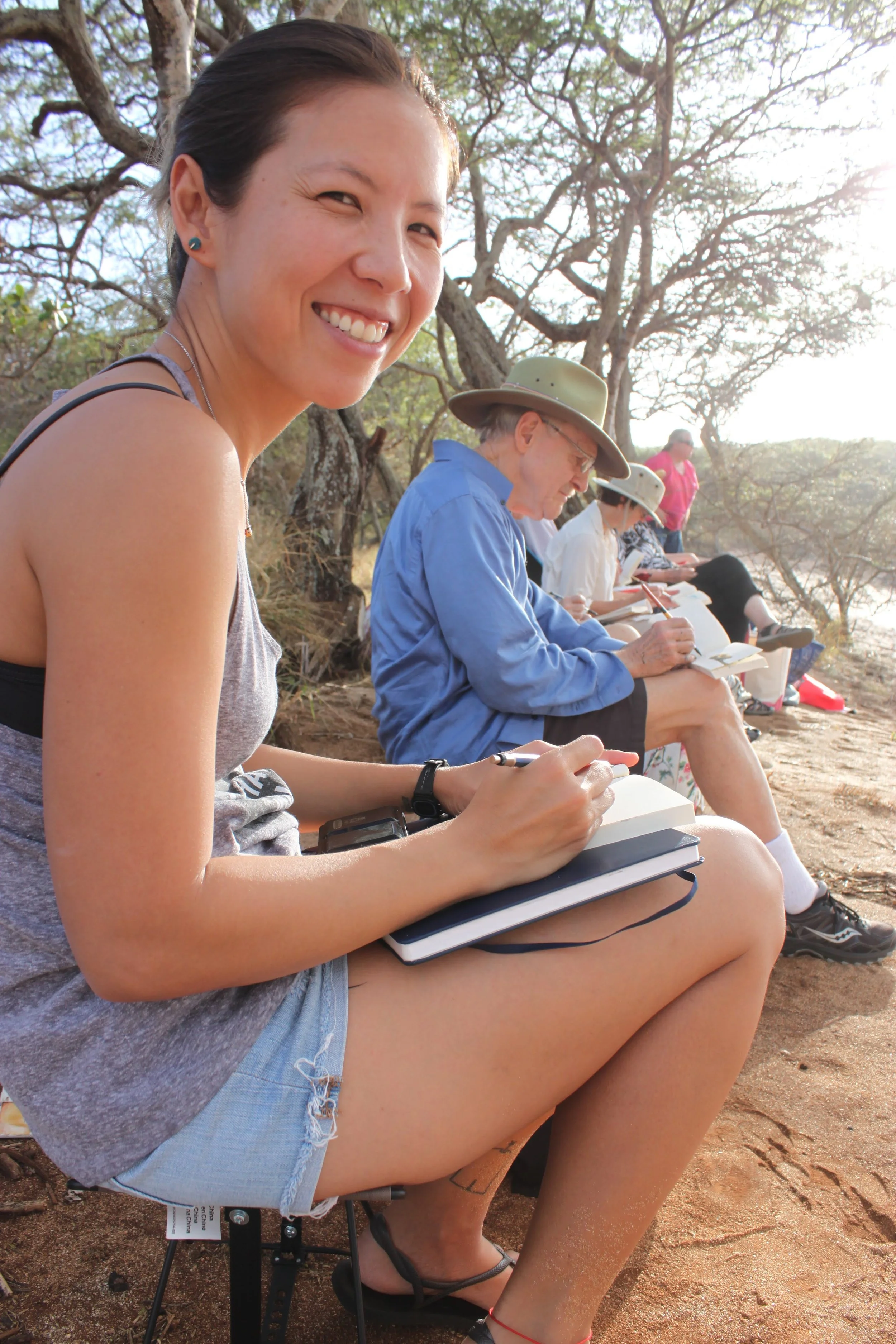 Bring the following when sketching en plein air: foldable chair, wide brimmed hat, sunscreen, basic art supplies, and a smile!