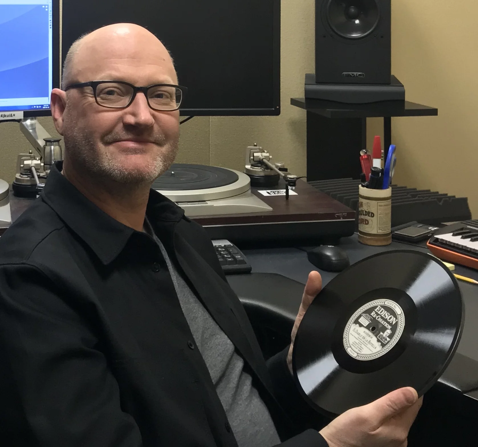 David Seubert, of the UCSB Special Research Collection, displays an Edison recording.