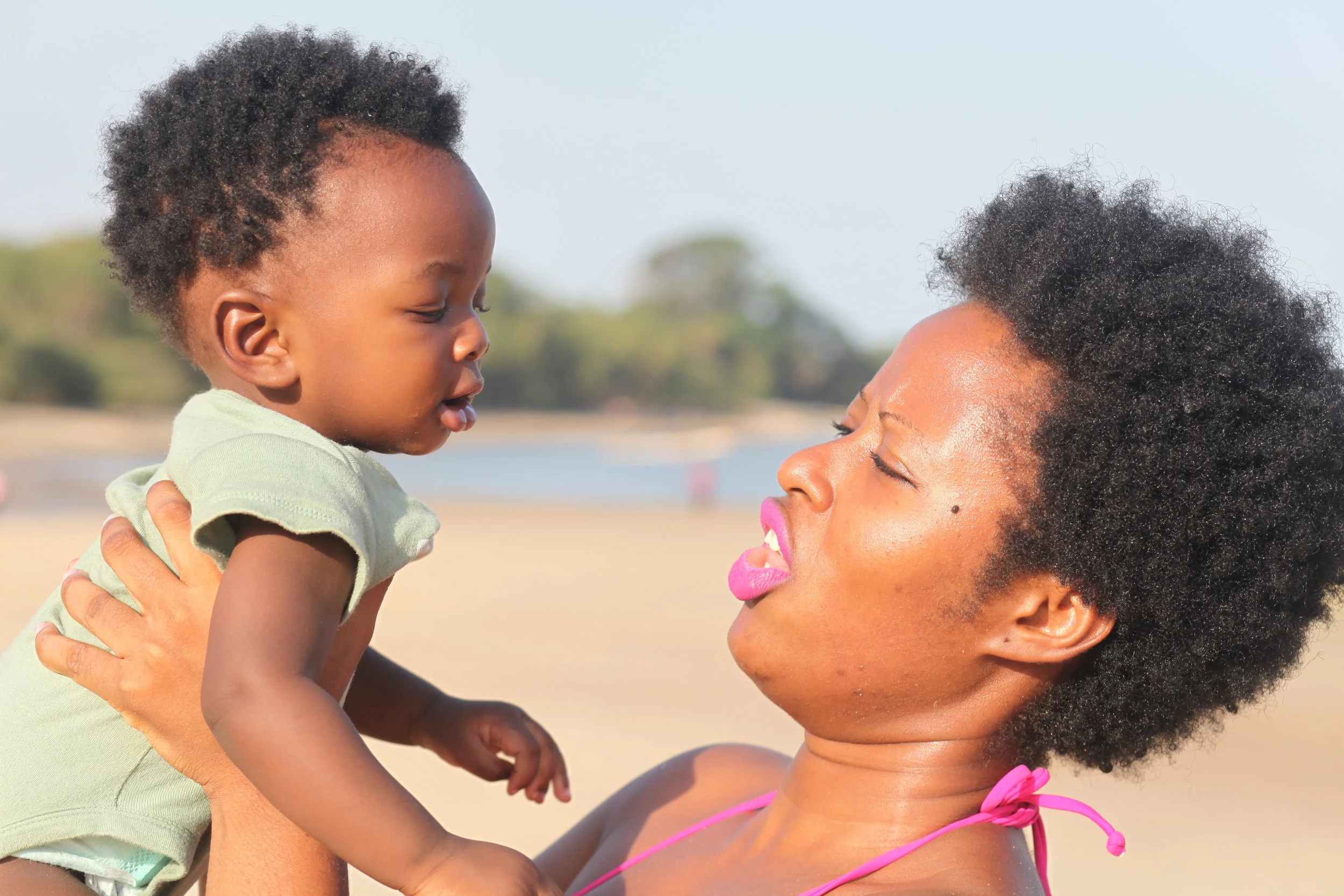 With Olu at 7 months old on Mama Beach in Sierra Leone