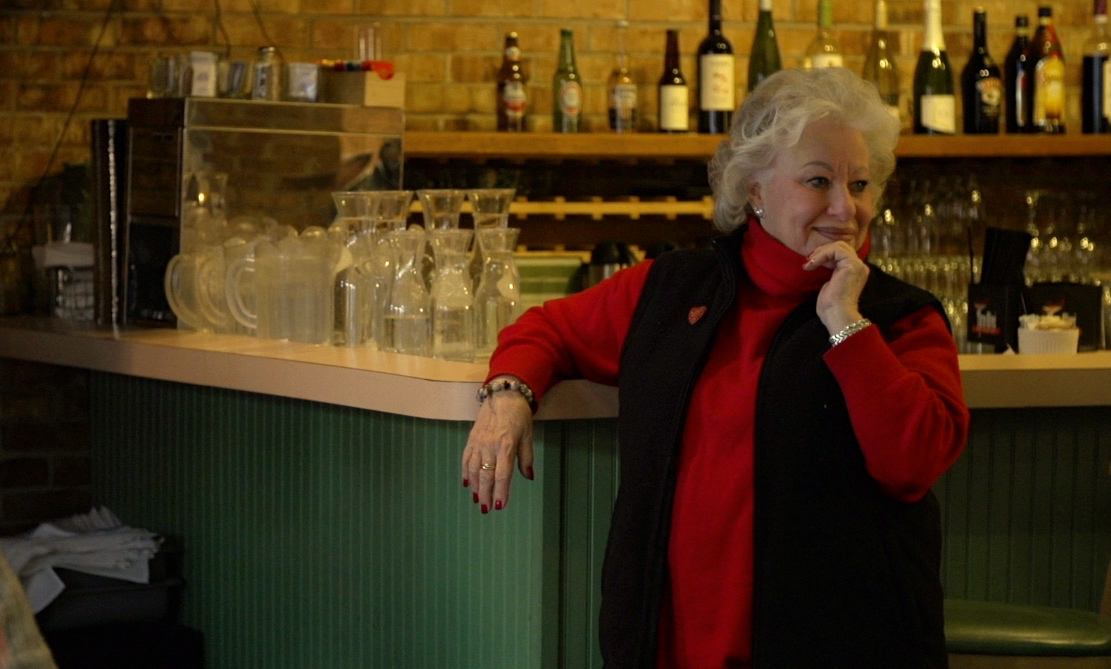 Ina Pinkney looks on lovingly at her full dining room, days before its closing