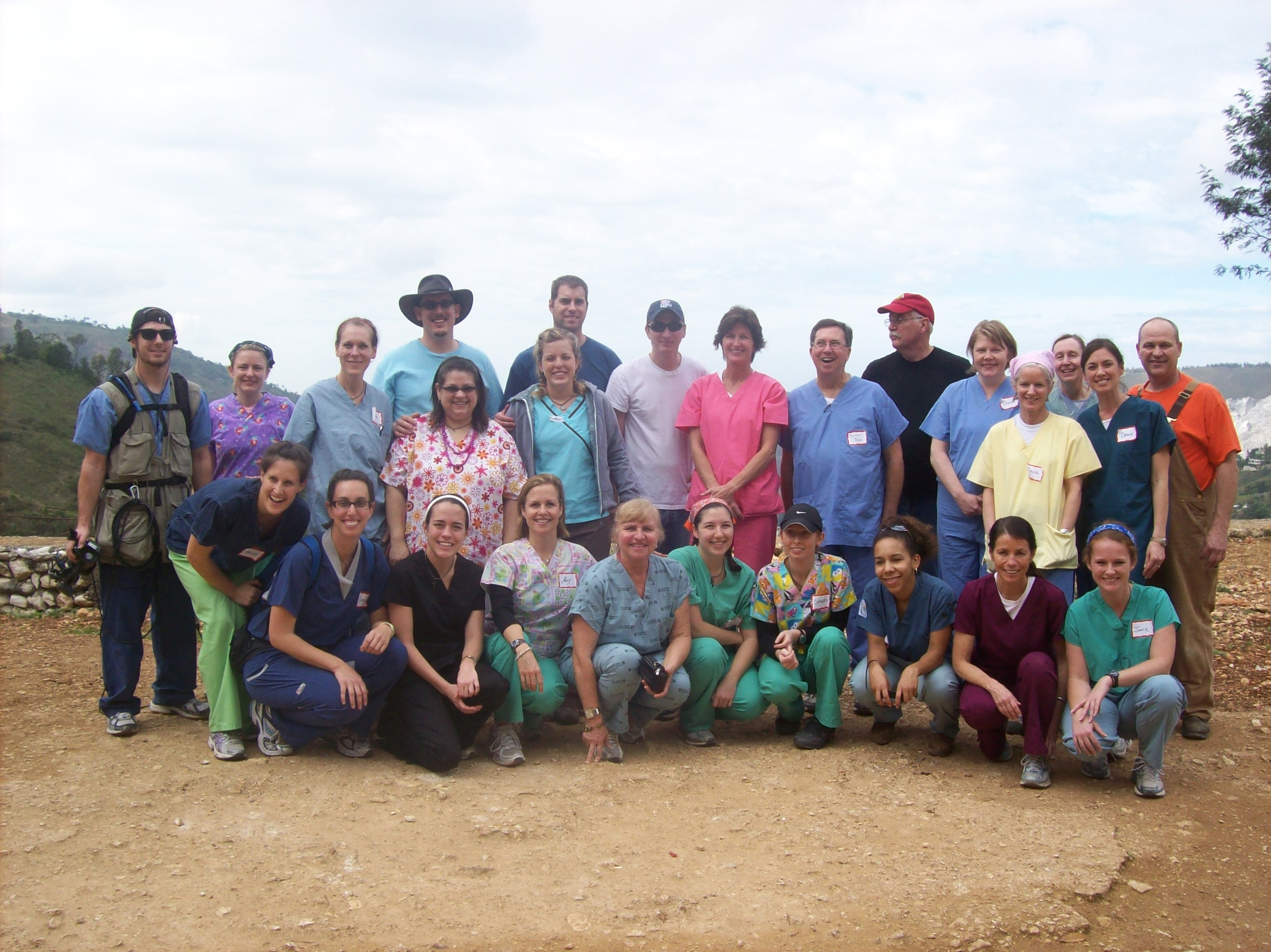 Filmmakers Ryan Atenhan and Mercedes Kane (far left) pose with the Little by Little medical team in Gramothe, Haiti.