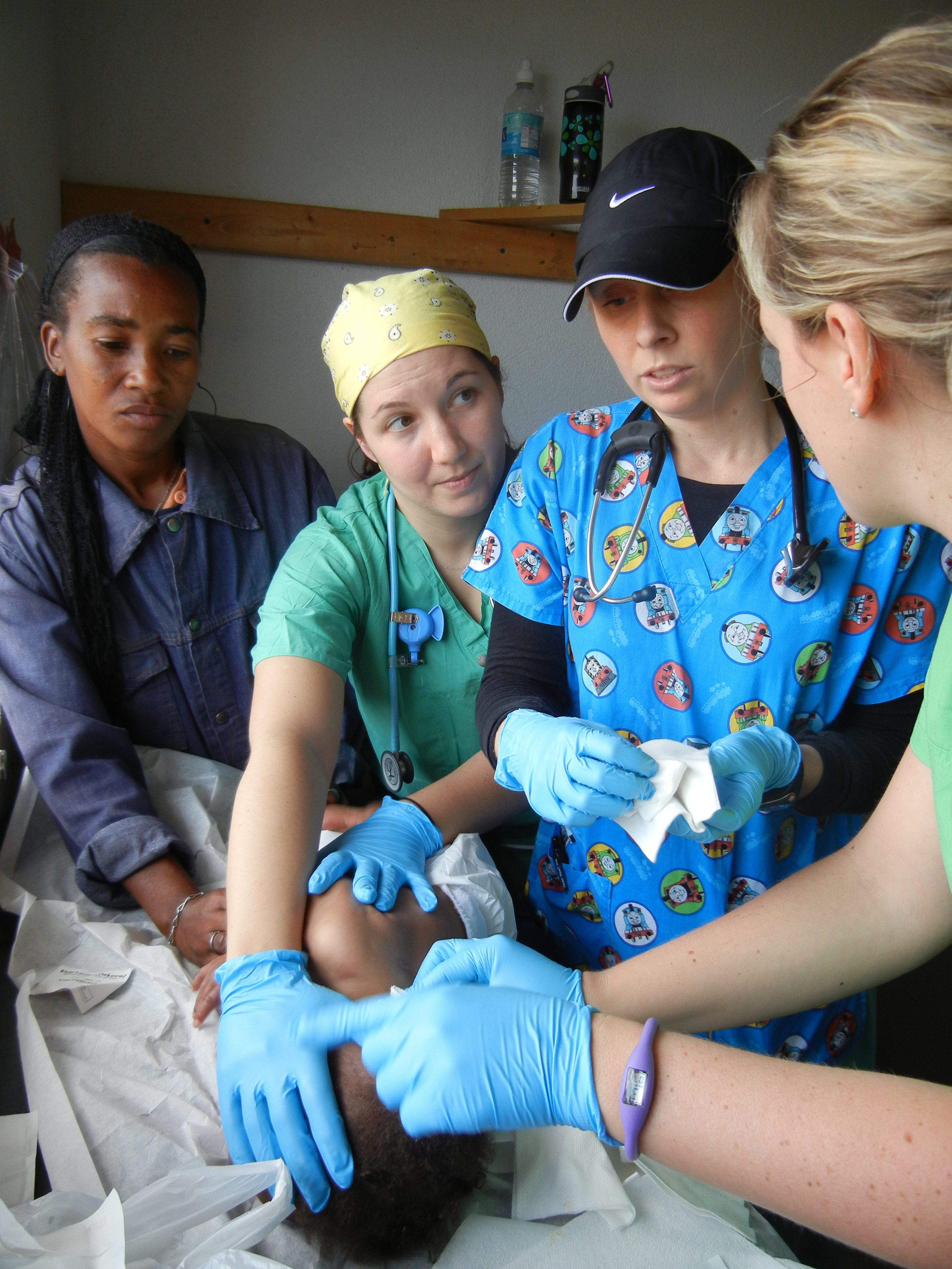 The Little by Little medical team works diligently in the MTM clinic in Gramothe, Haiti. 