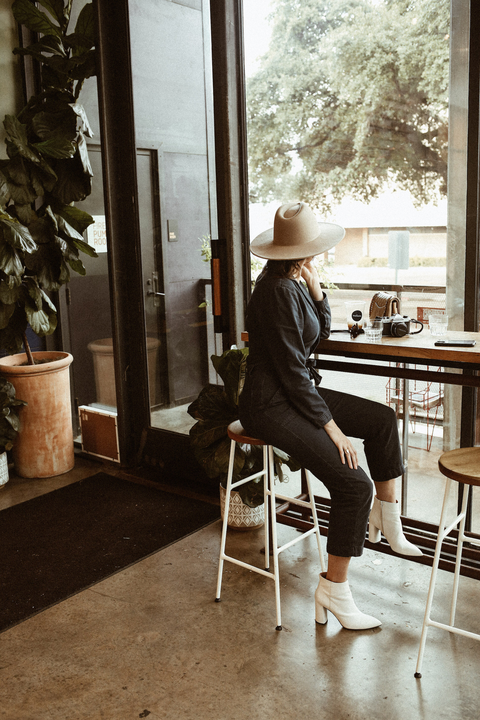 woman having her coffee at MAÑANA for Austin Guide