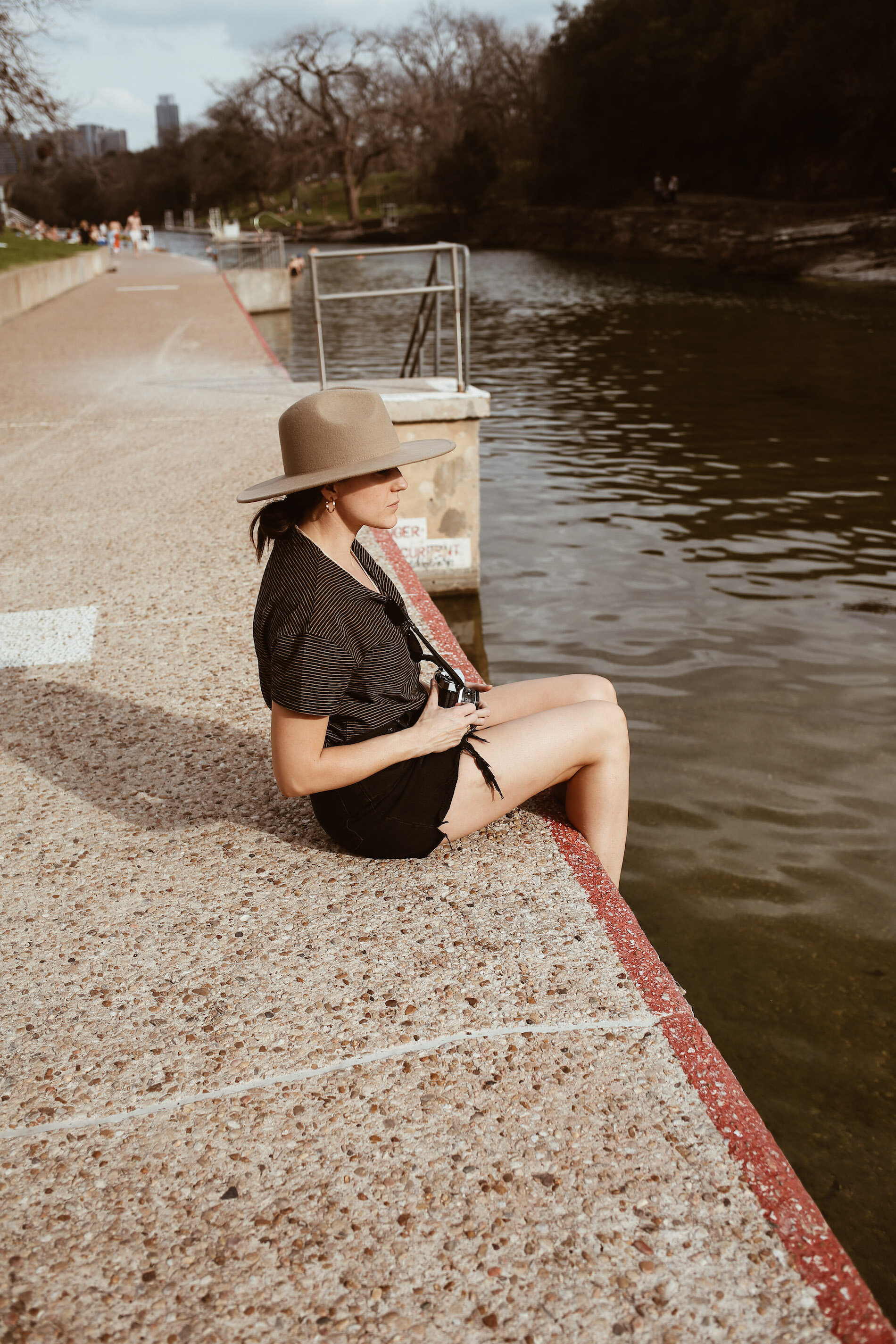 woman sitting near the BARTON SPRINGS