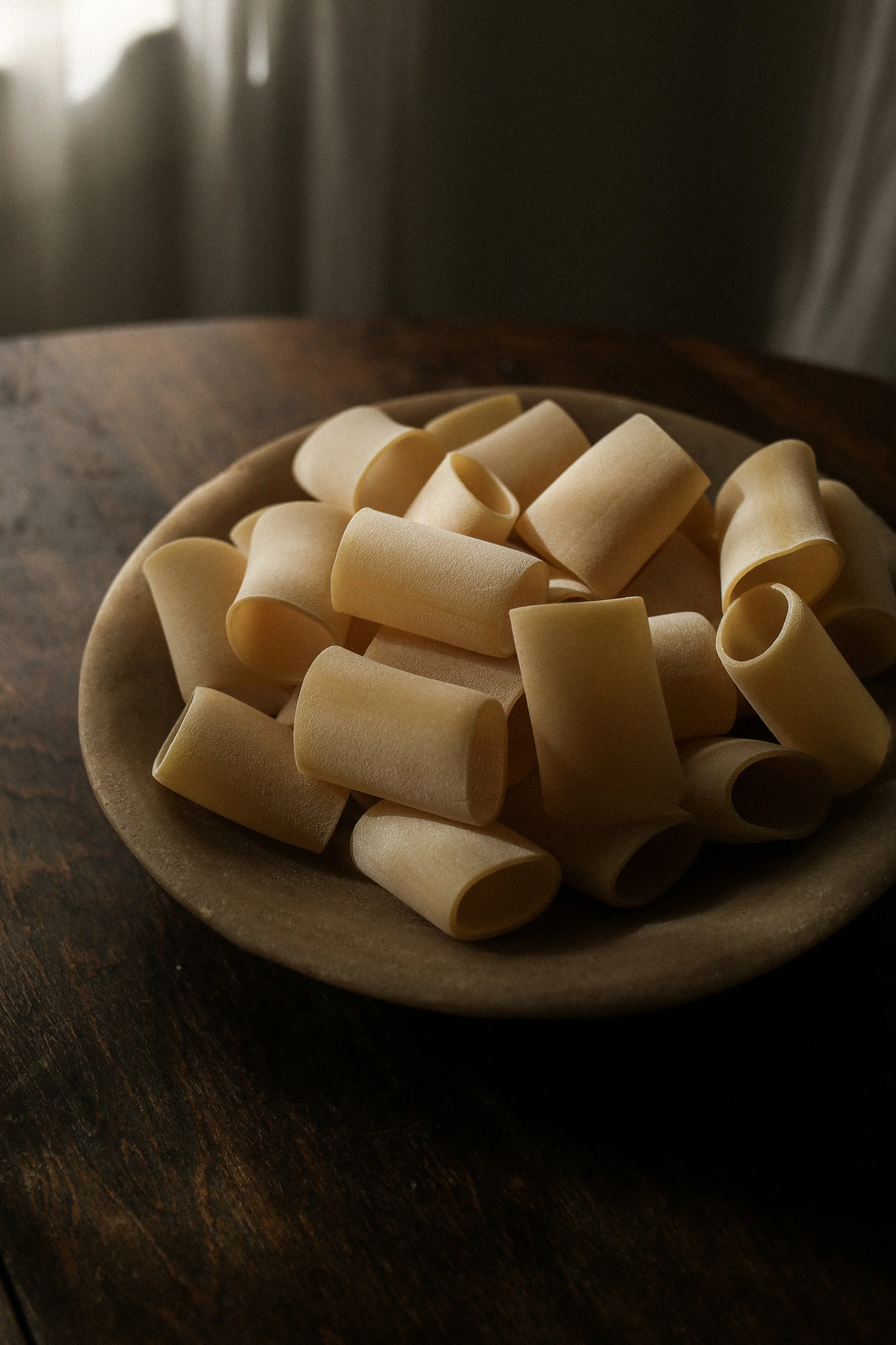 bowl of dried paccheri pasta